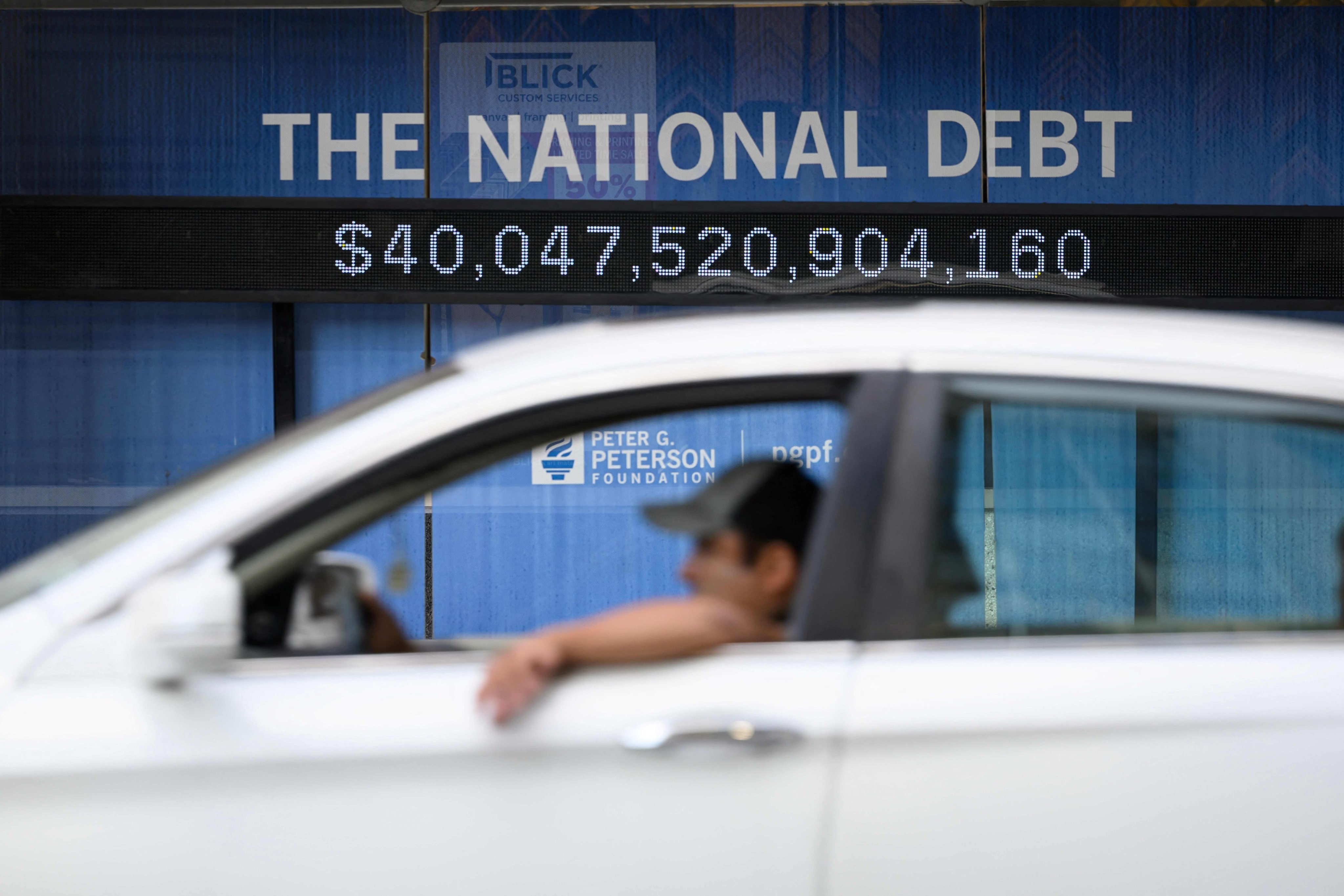 An electronic display shows the US national debt in Washington on August 19. The US national debt exceeded a record US$40 trillion. The uptick in borrowing comes as longer term US obligations linked to social security and health care have been growing, while interest payments have climbed as well. Photo: AFP