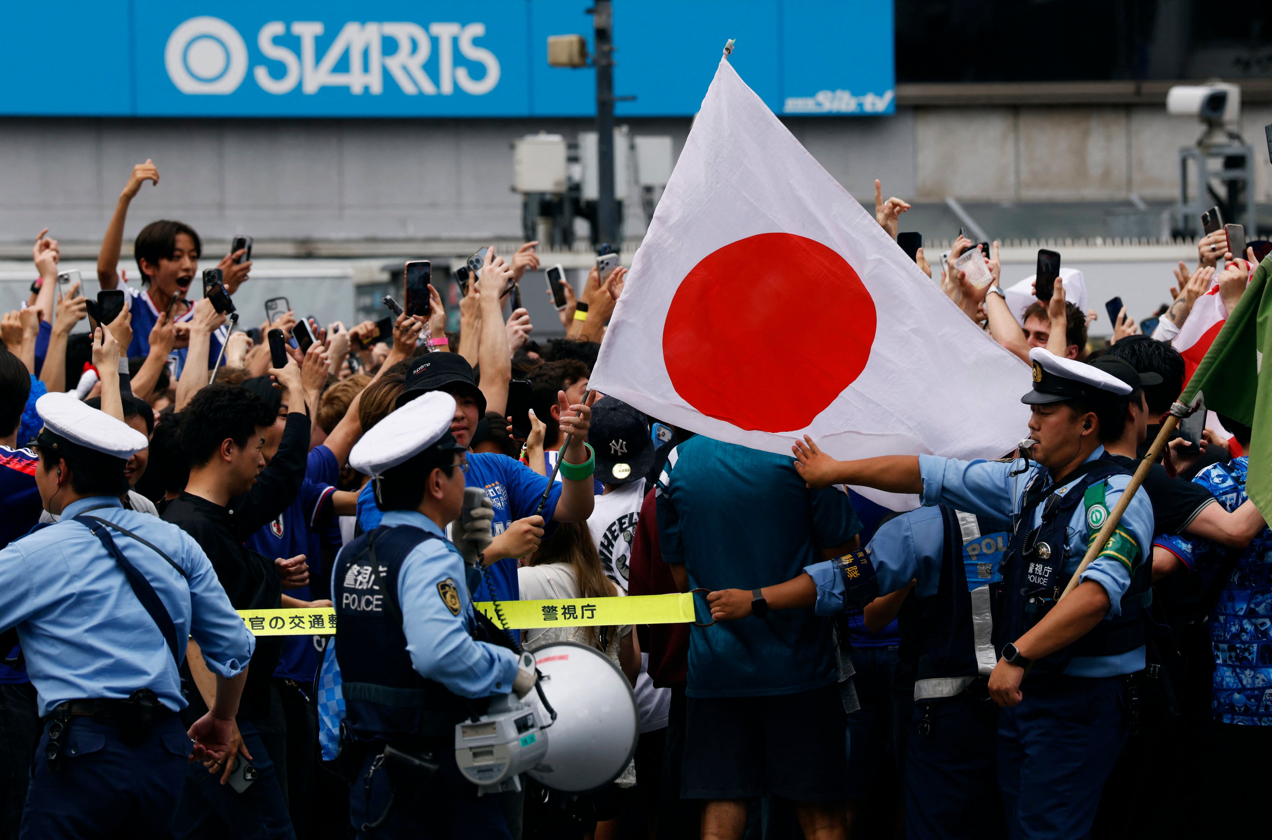 Police officers at Shibuya Crossing in Tokyo, Japan in June. Photo: Reuters