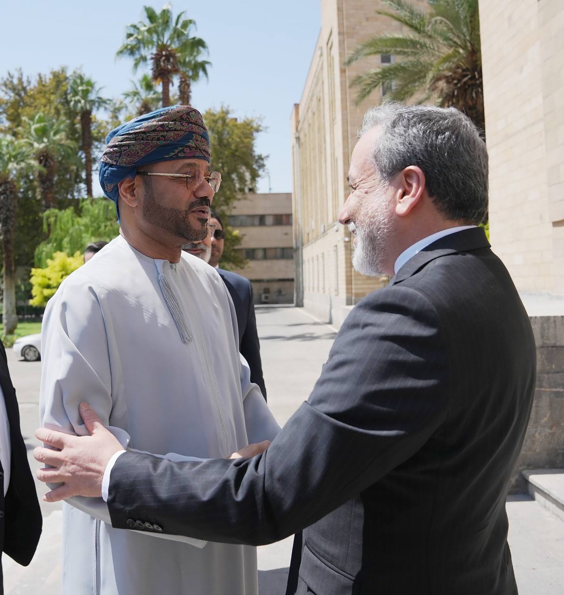 Iranian Foreign Minister Abbas Araghchi (right) greets Omani Foreign Minister Sayyid Badr Al Busaidi in Tehran on Tuesday. Photo: Iran’s Ministry of Foreign Affairs/EPA