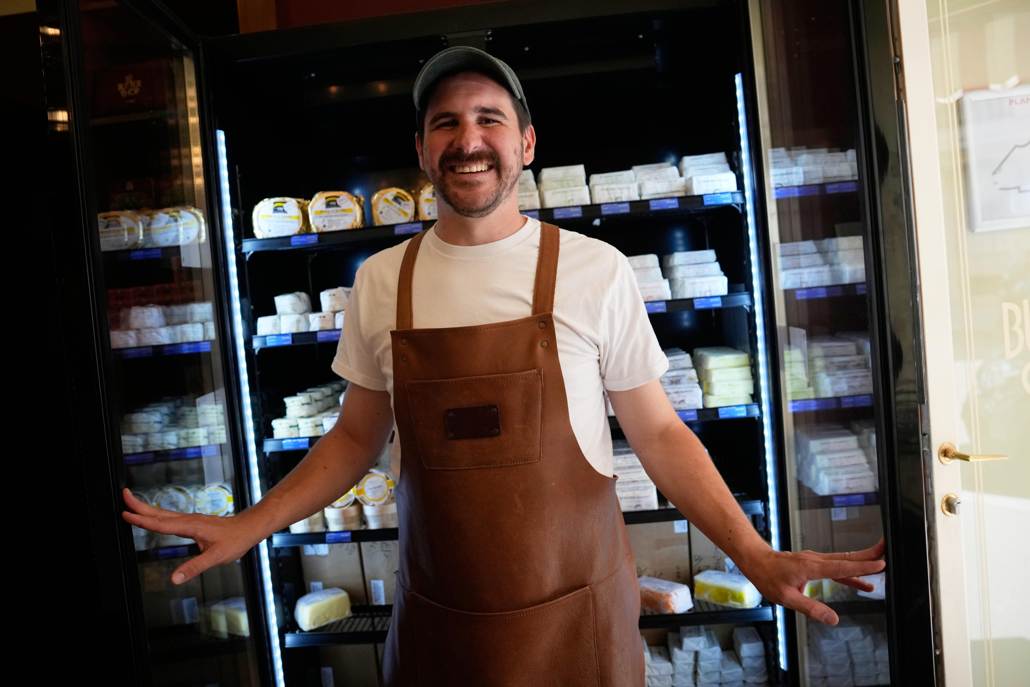 Erwan Leo, owner of Le Butter Shop, stands in front of a fridge at his shop that is devoted entirely to butter in Paris, France, on August 25, 2026. Photo: AP Photo/Christophe Ena