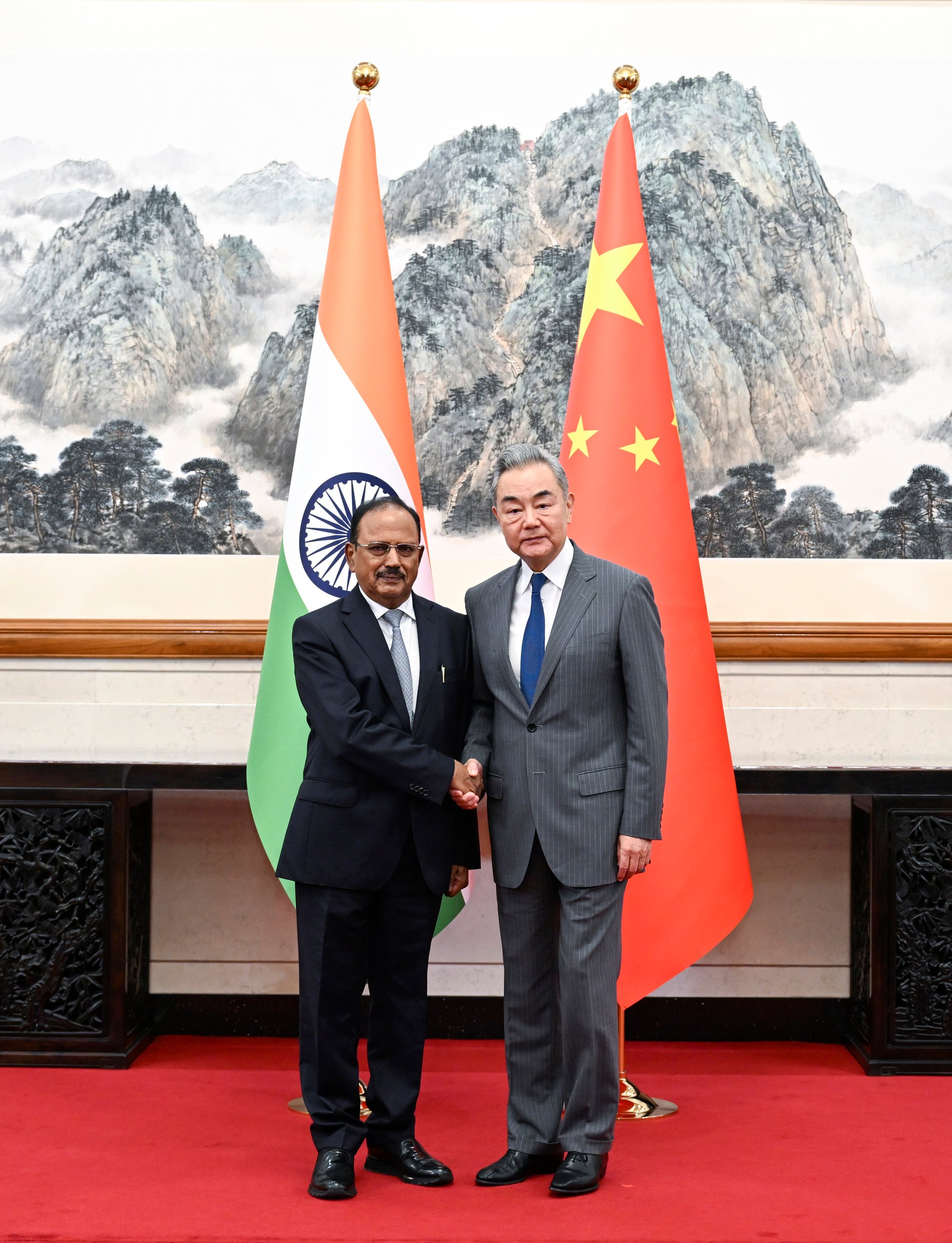 Wang Yi, China's top diplomat, and Ajit Doval, India's national security adviser, meet in Beijing on Tuesday. Photo: Xinhua