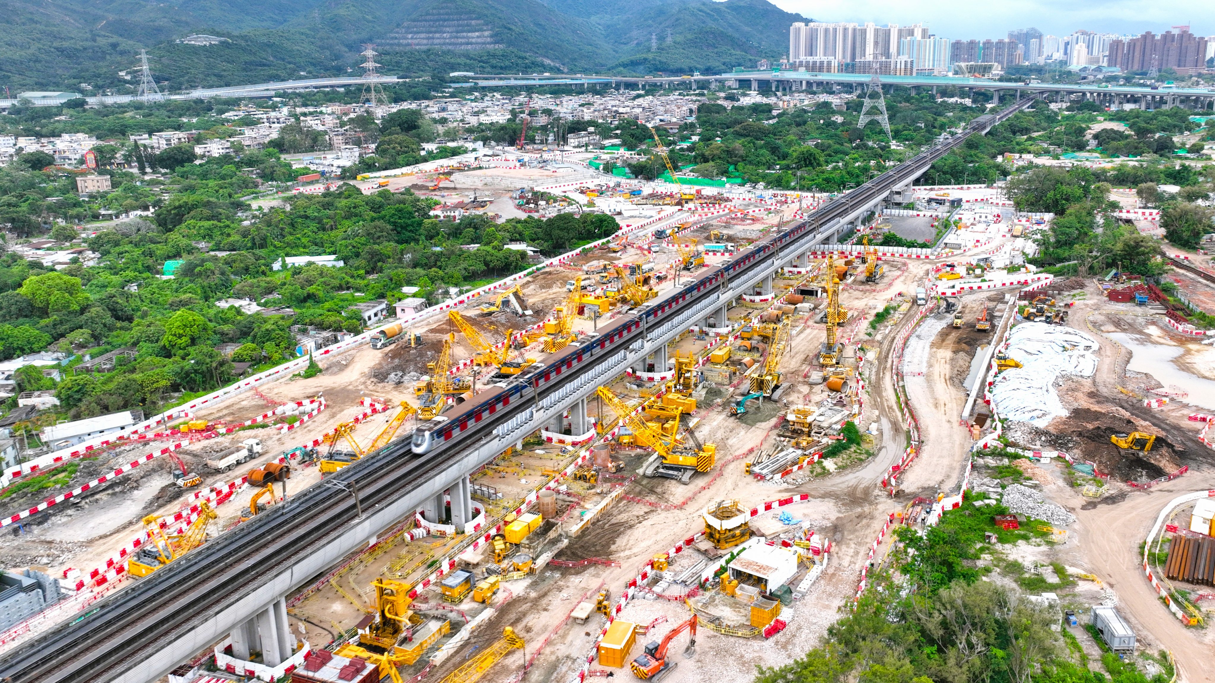 Hung Shui Kiu station will be Hong Kong’s first built on an operating railway viaduct, with sections skidded into position beside the Tuen Ma line. Photo: MTRC