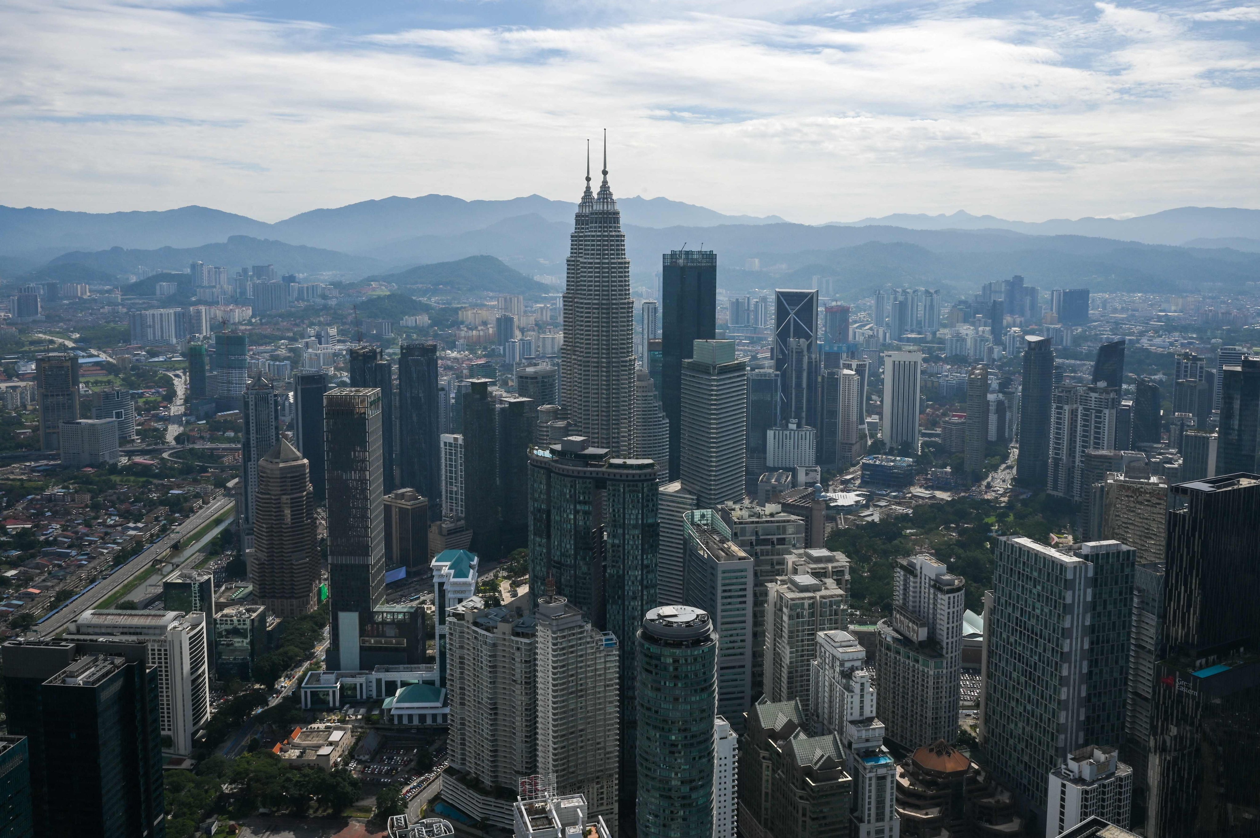 The Petronas Twin Towers and other commercial buildings as seen from KL Tower in Kuala Lumpur. Photo: AFP