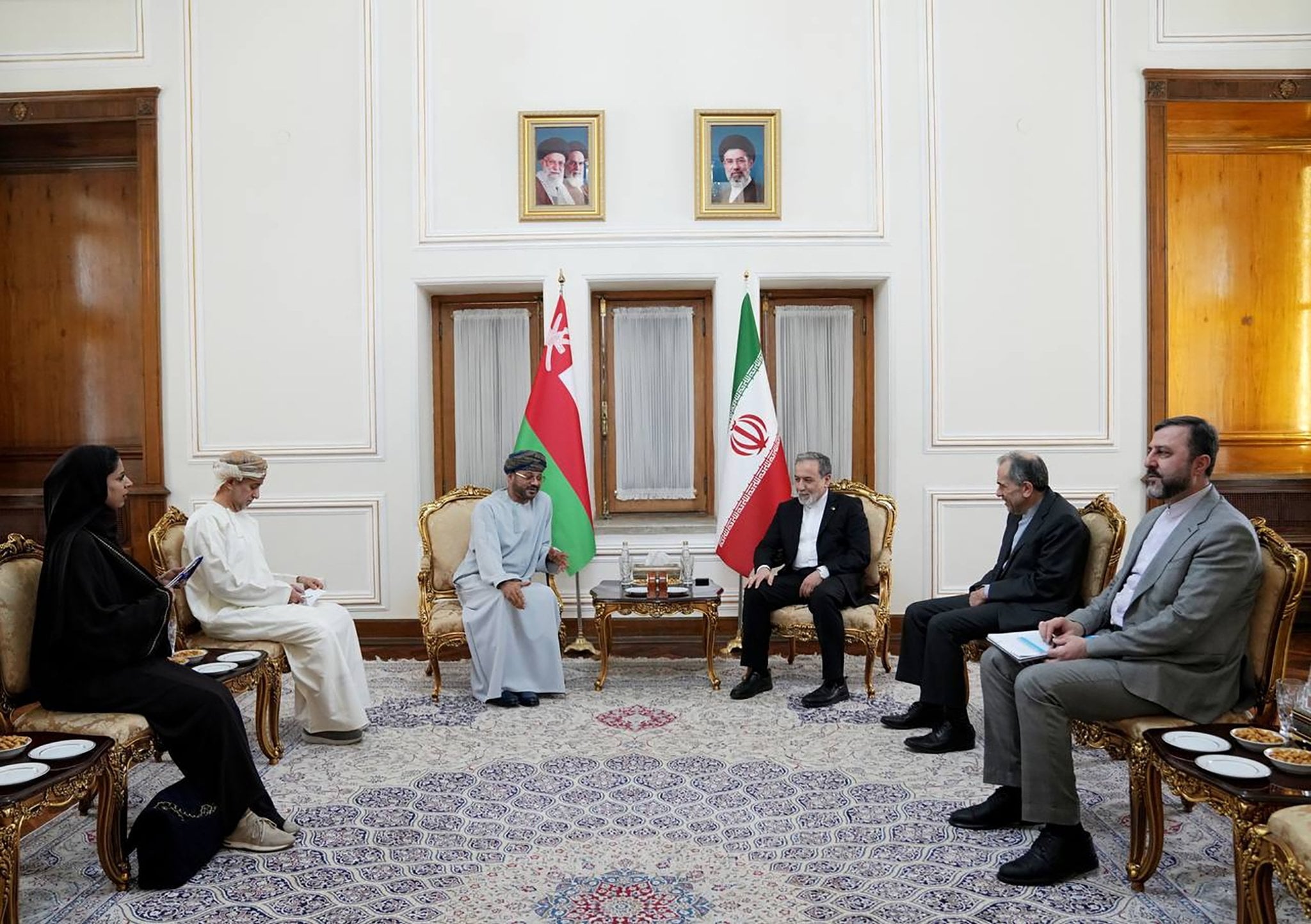 Iranian Foreign Minister Abbas Araghchi (centre right) meets Omani Foreign Minister Sayyid Badr Al Busaidi in Tehran on Tuesday. Photo: Iran’s Ministry of Foreign Affairs/EPA