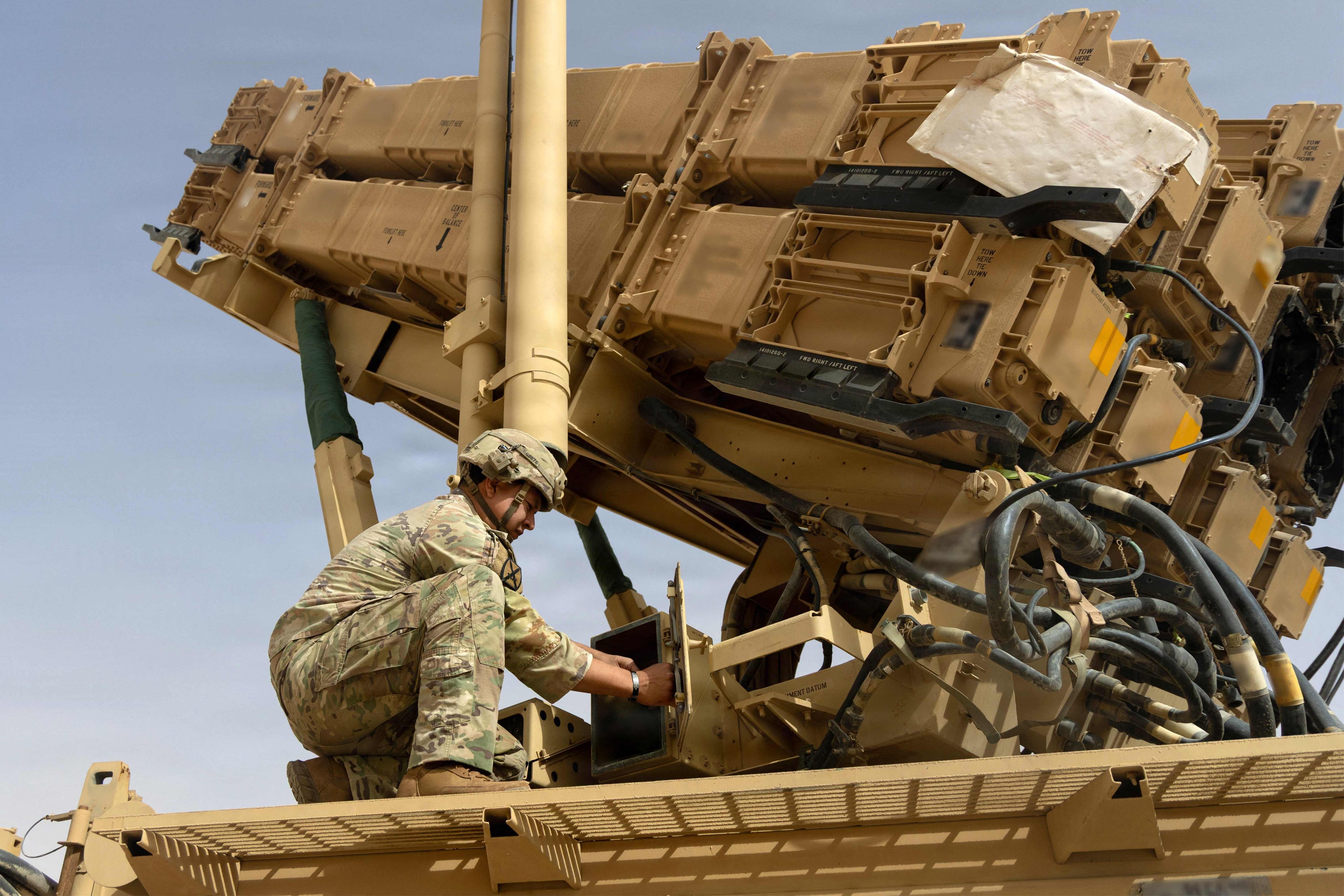 A US Army air defence artilleryman conducts maintenance on an MIM-104 Patriot missile system at an undisclosed location in the Middle East, in an image released in June. Photo: US Army via AFP