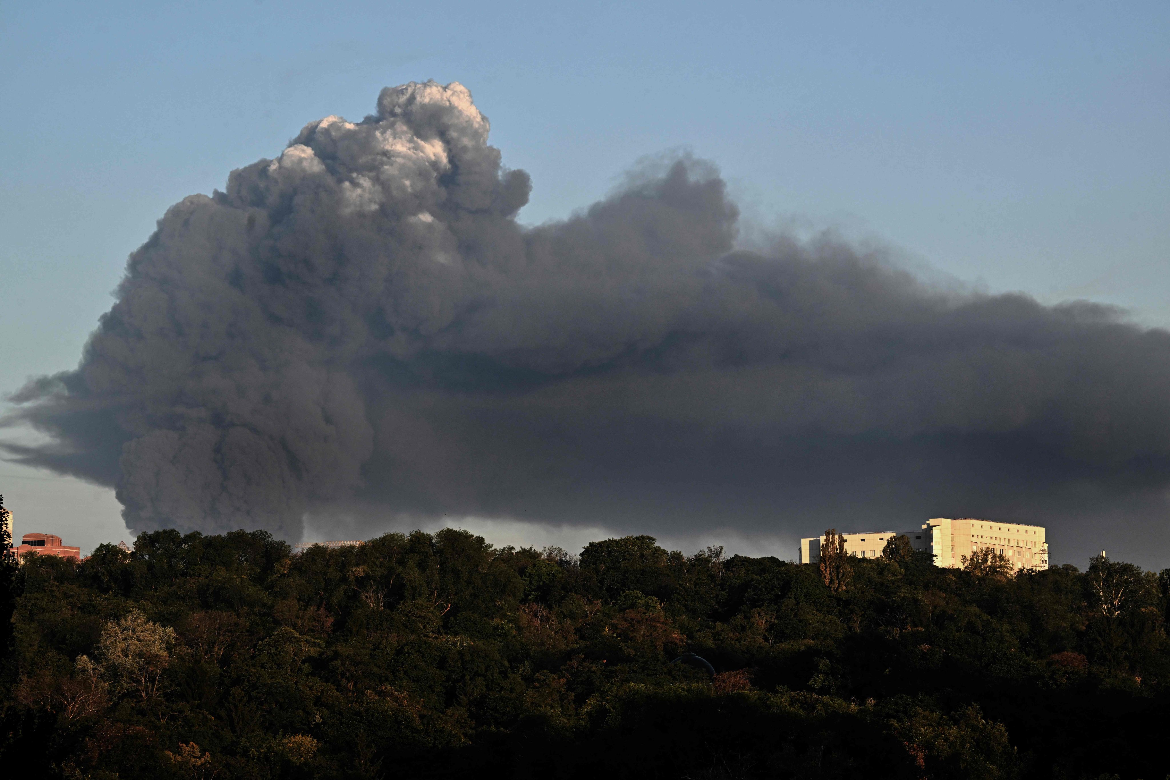 A dark smoke plume billows following a drone strike in Kyiv, on Saturday. Photo: AFP