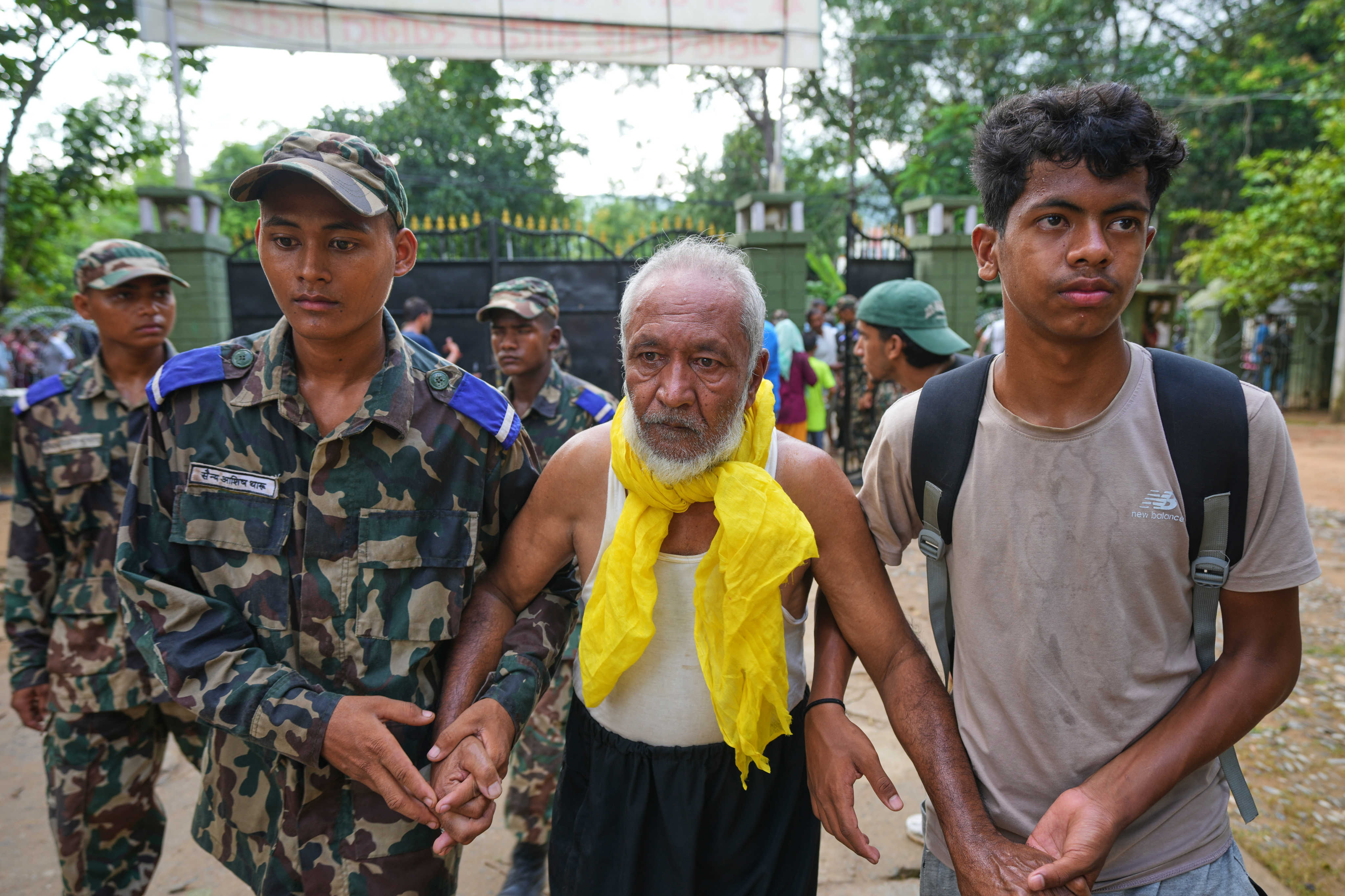 A flash flood survivor is taken to a medical camp in the Nuwakot district of Nepal on Friday. Photo: AP