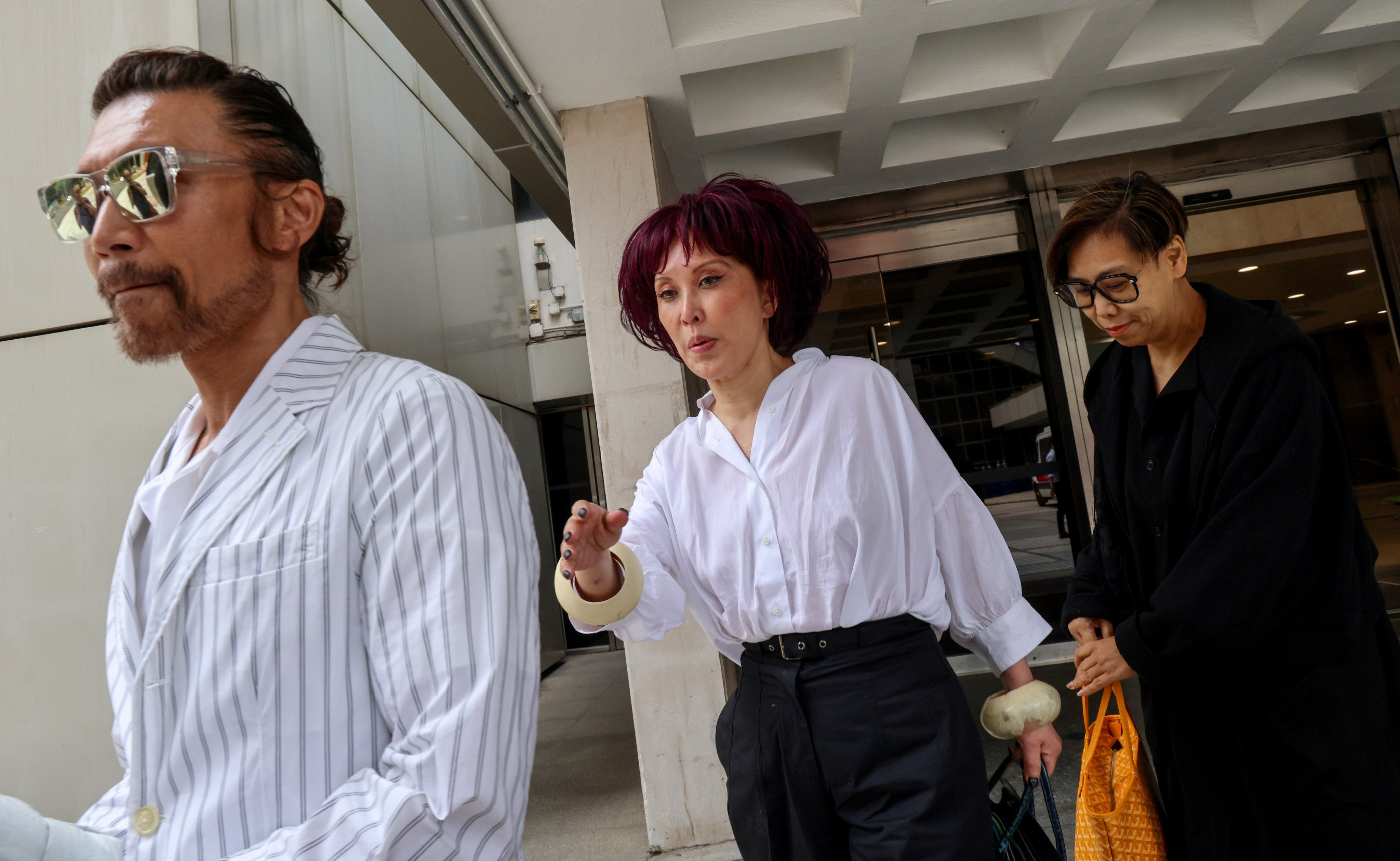 Pearl Ling (centre) leaves the High Court following a hearing in 2024. Photo: Jelly Tse