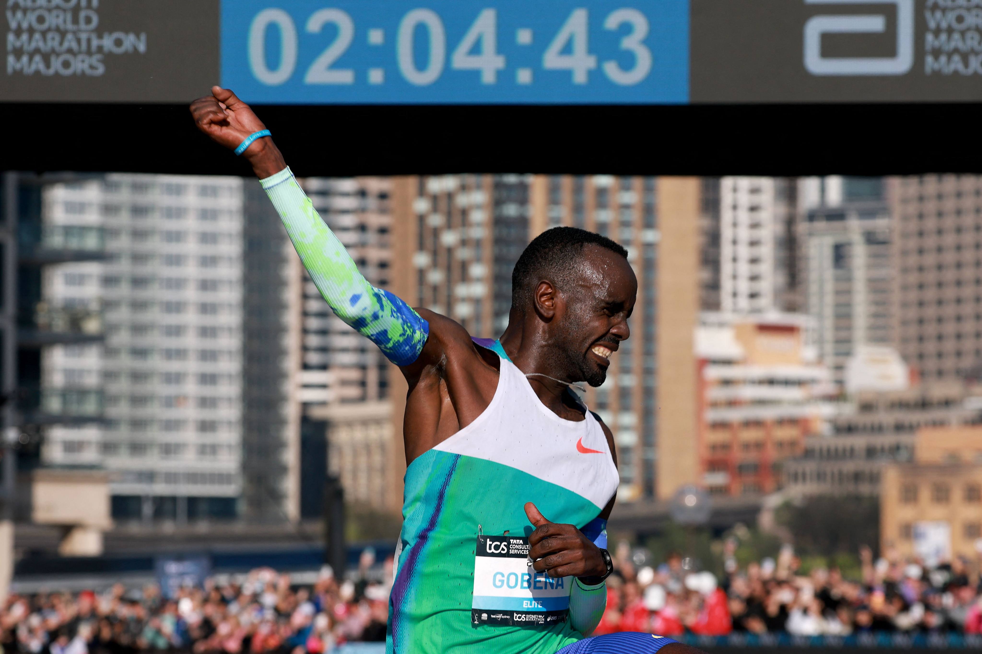 Ethiopia’s Addisu Gobena celebrates as he crosses the finish line to win the 2026 Sydney Marathon. Photo: AFP