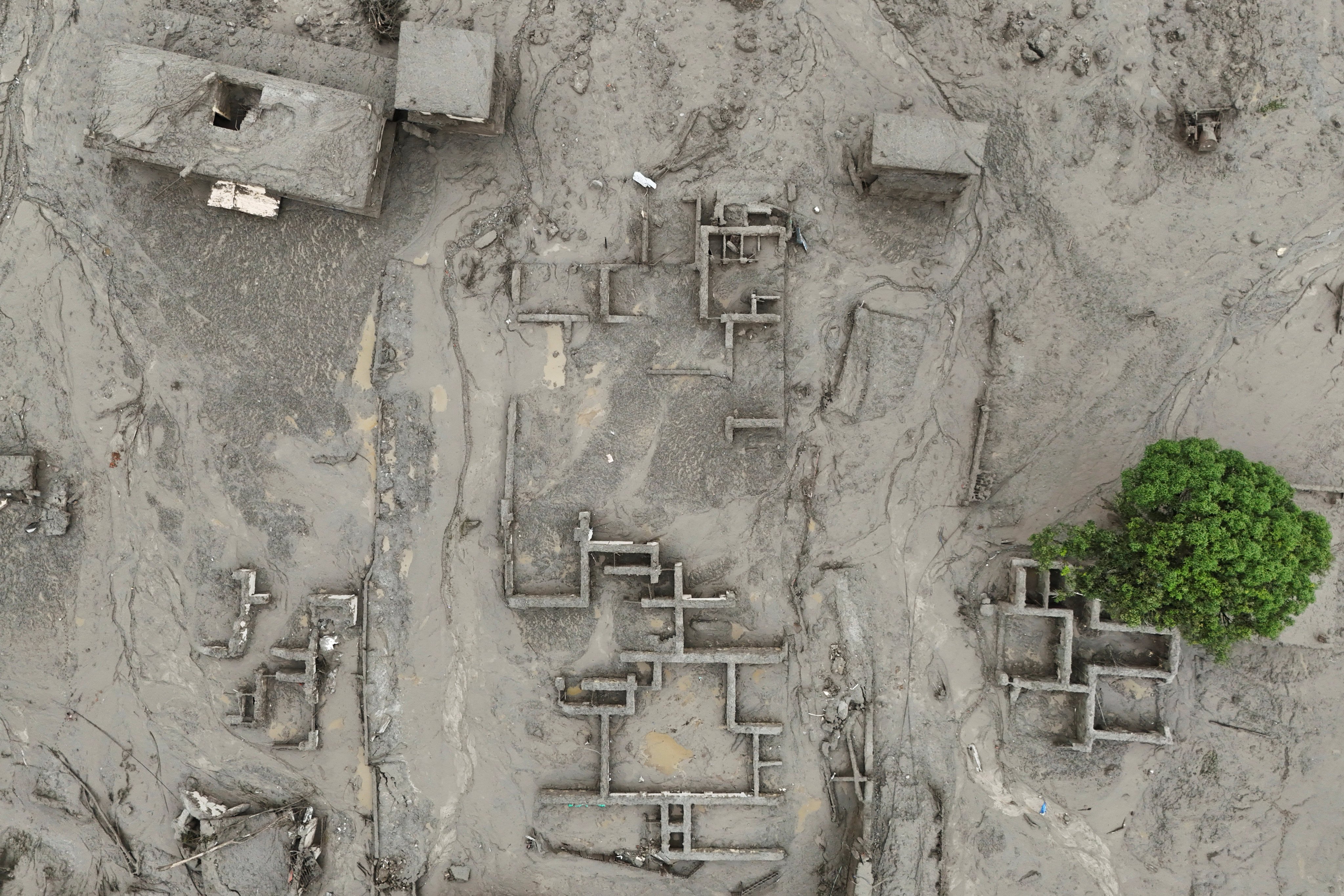 A drone view shows mud covering properties following a flash flood in Trishuli, Nuwakot district, Nepal, on August 27. Photo: Reuters