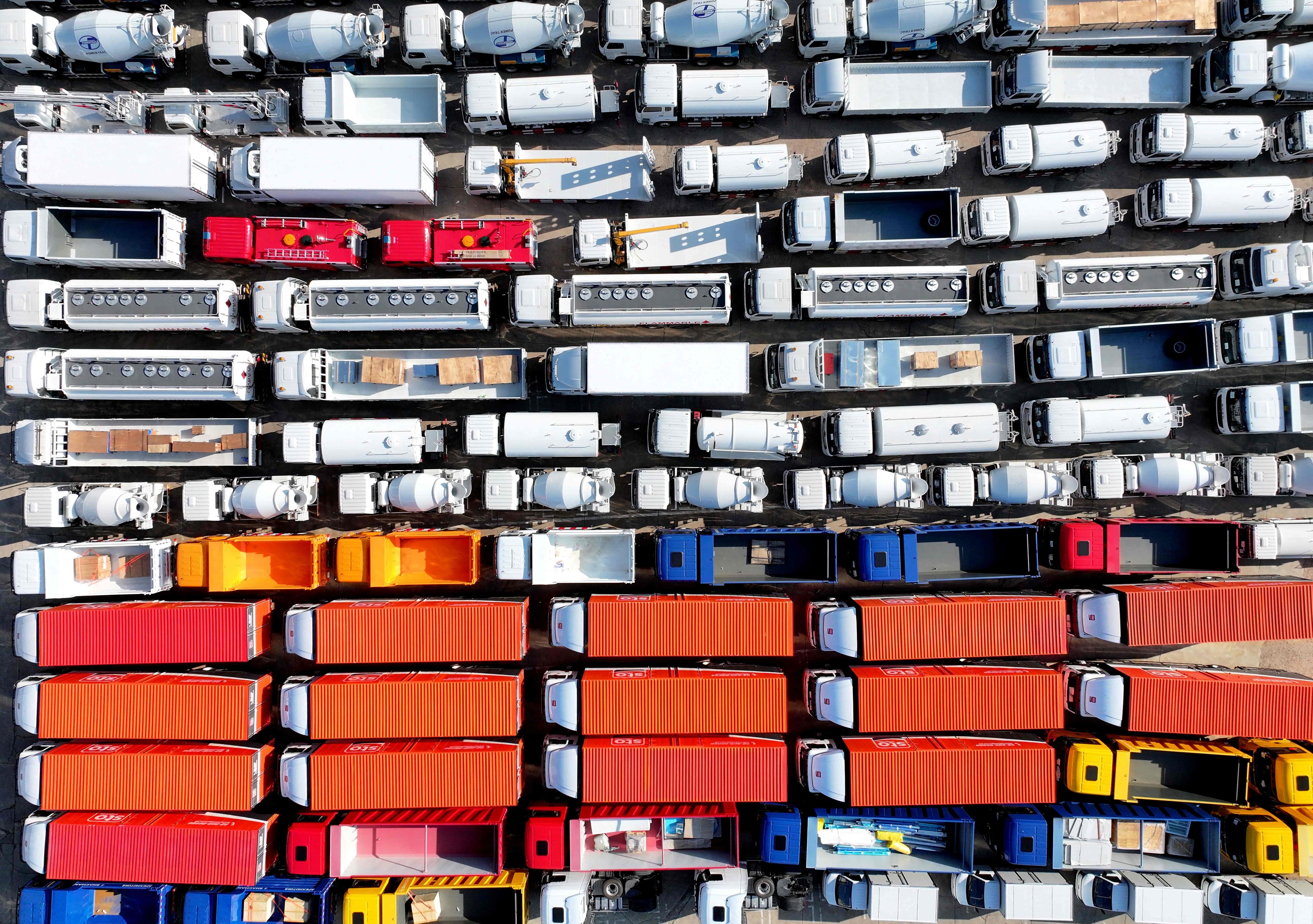 Trucks for export are seen at a port in Lianyungang in eastern China’s Jiangsu province on August 6. Photo: AFP