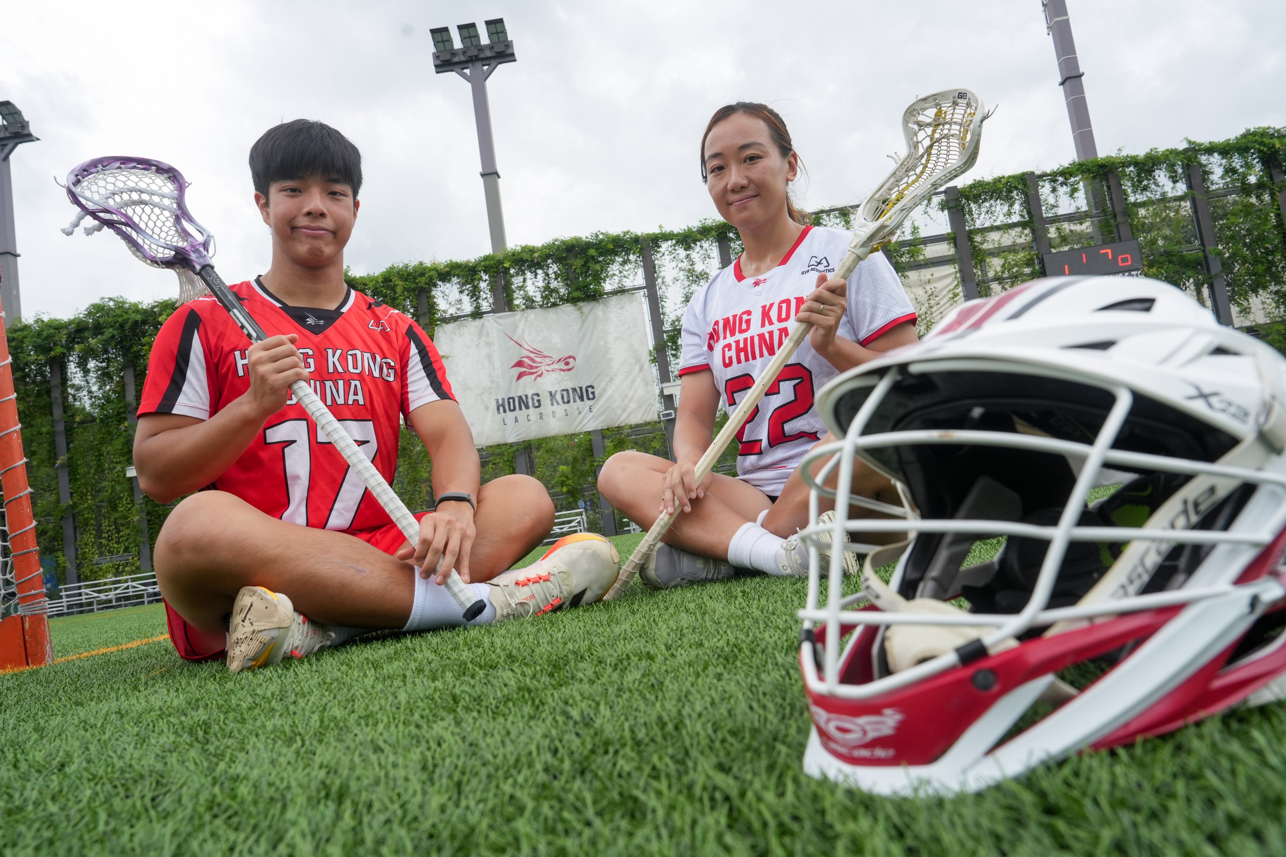 Hong Kong women’s captain Sally Tang (right) and Baron Lee are at opposite ends of their lacrosse careers, but the likelihood of either playing at an Olympics is slim. Photo: Sun Yeung