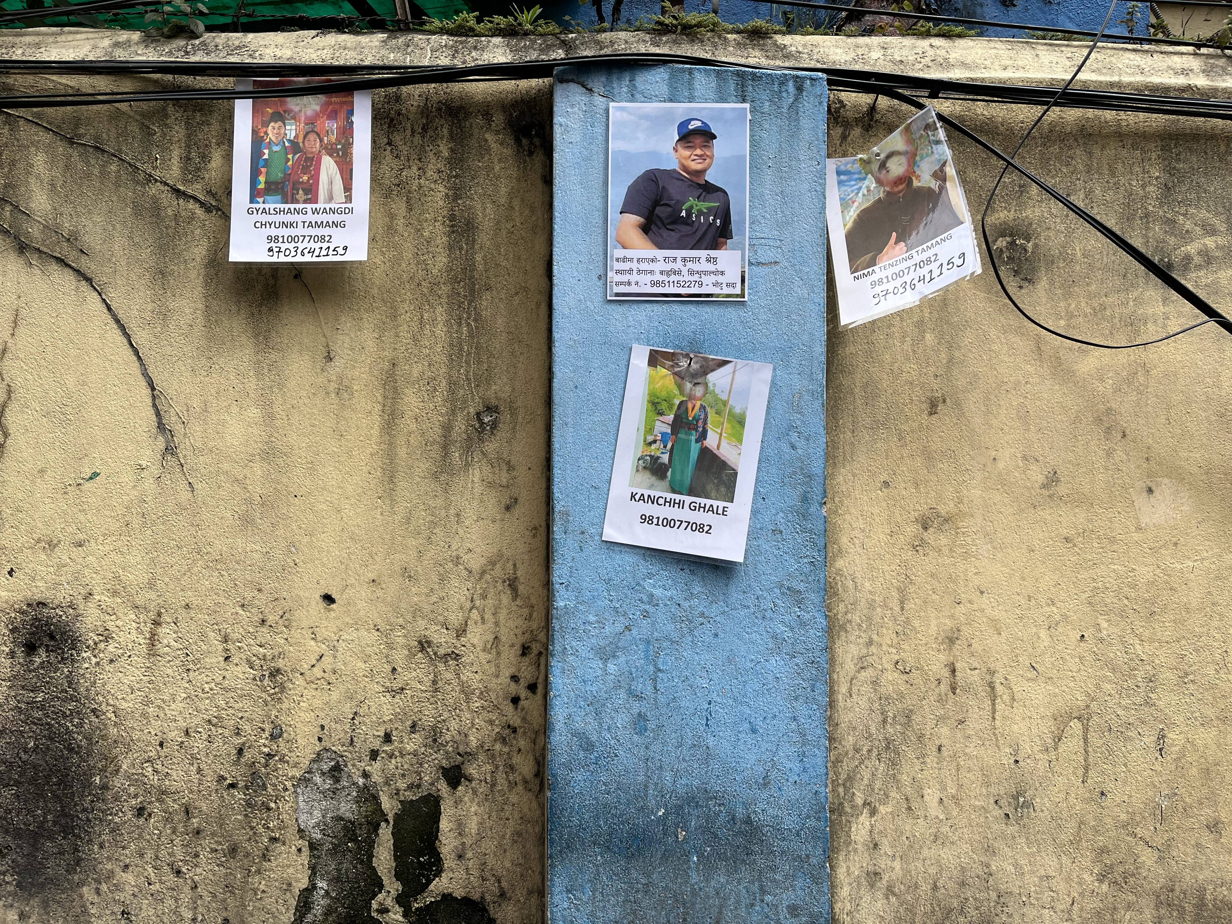 Photos of people missing in the flood are pasted outside a Kathmandu hospital. Photo: Bibek Bhandari