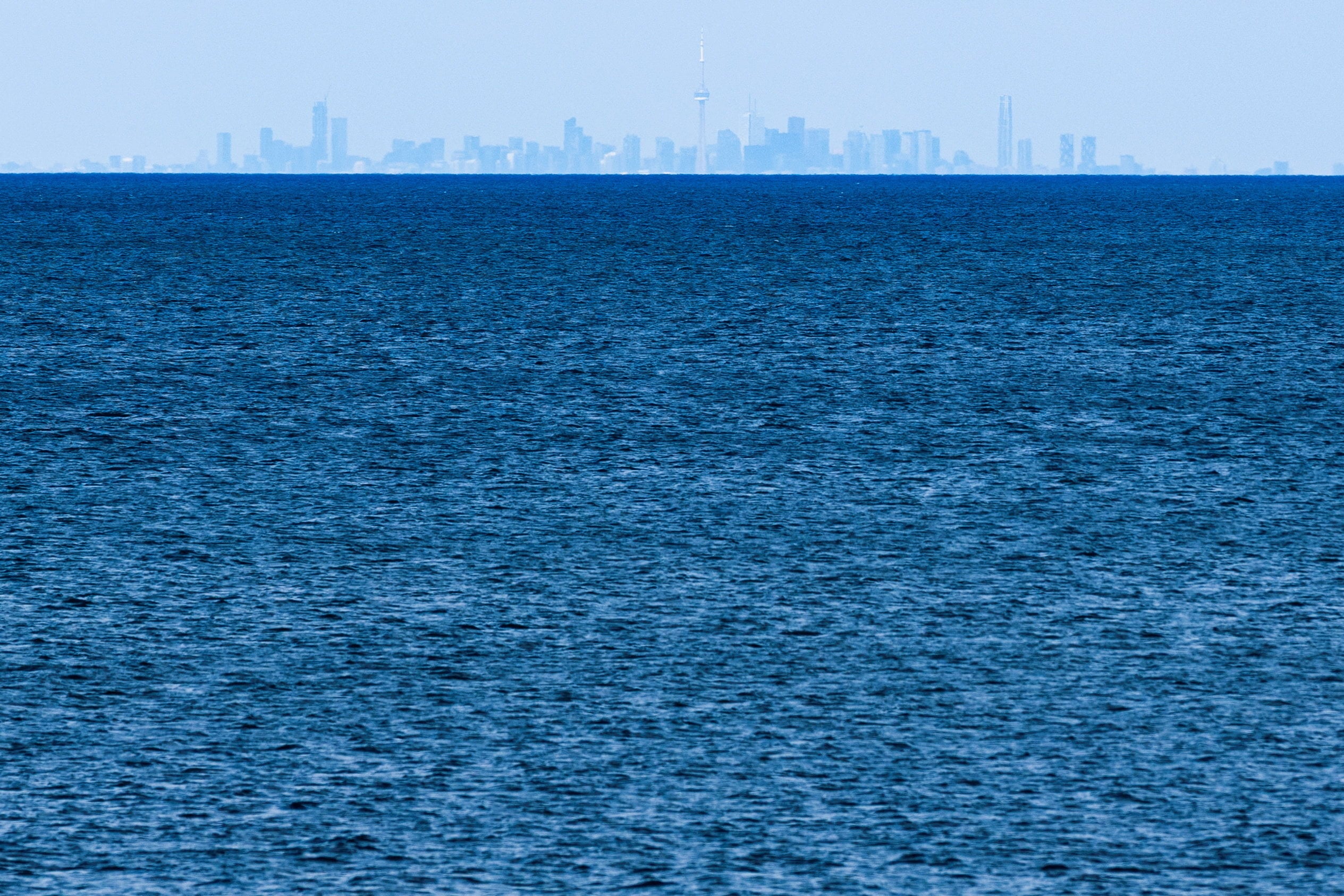 The Toronto skyline in the distance across Lake Ontario. Photo: Reuters