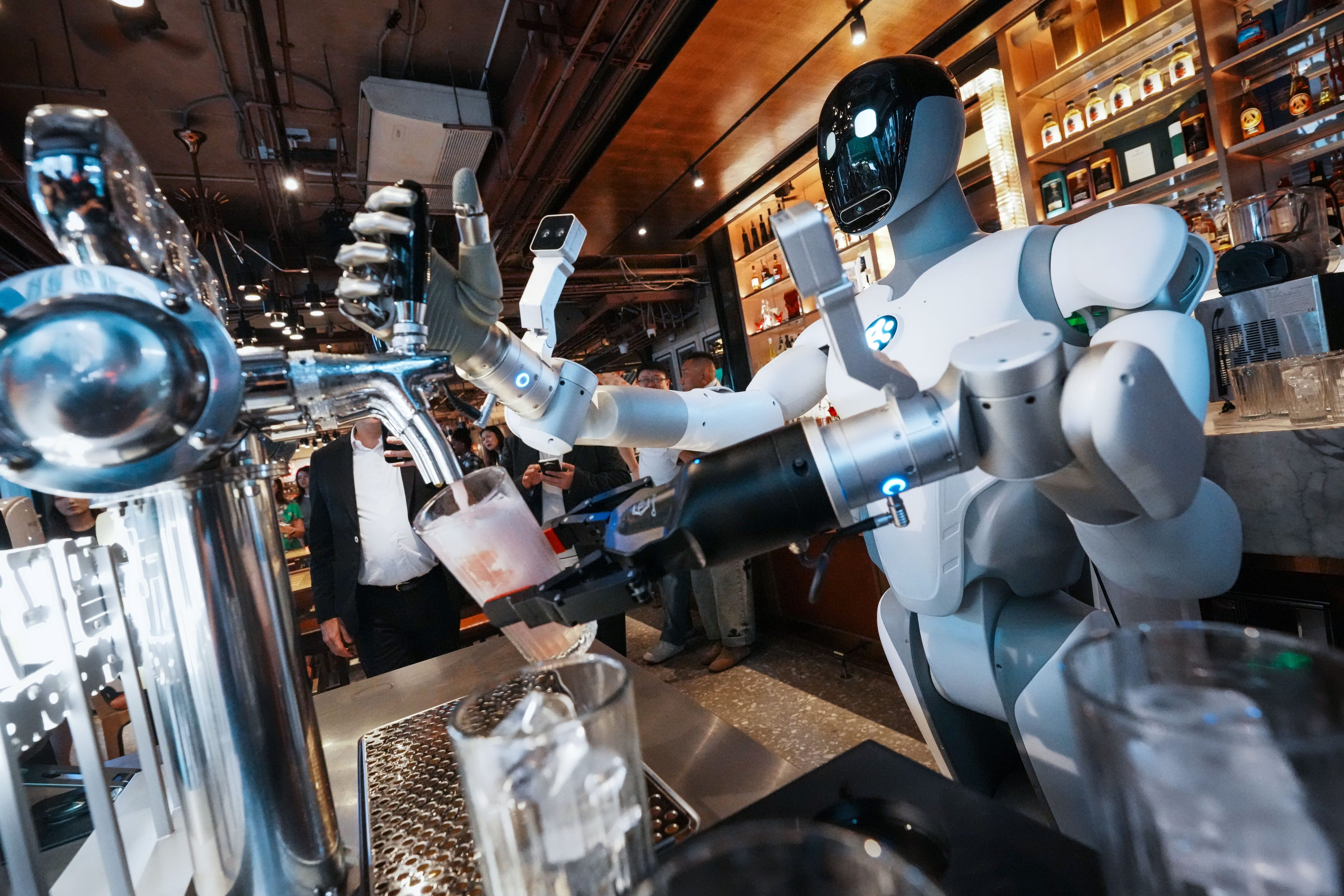 A general-purpose intelligent robot works in Lan Kwai Fong, Hong Kong, on August 31. Photo: Dickson Lee