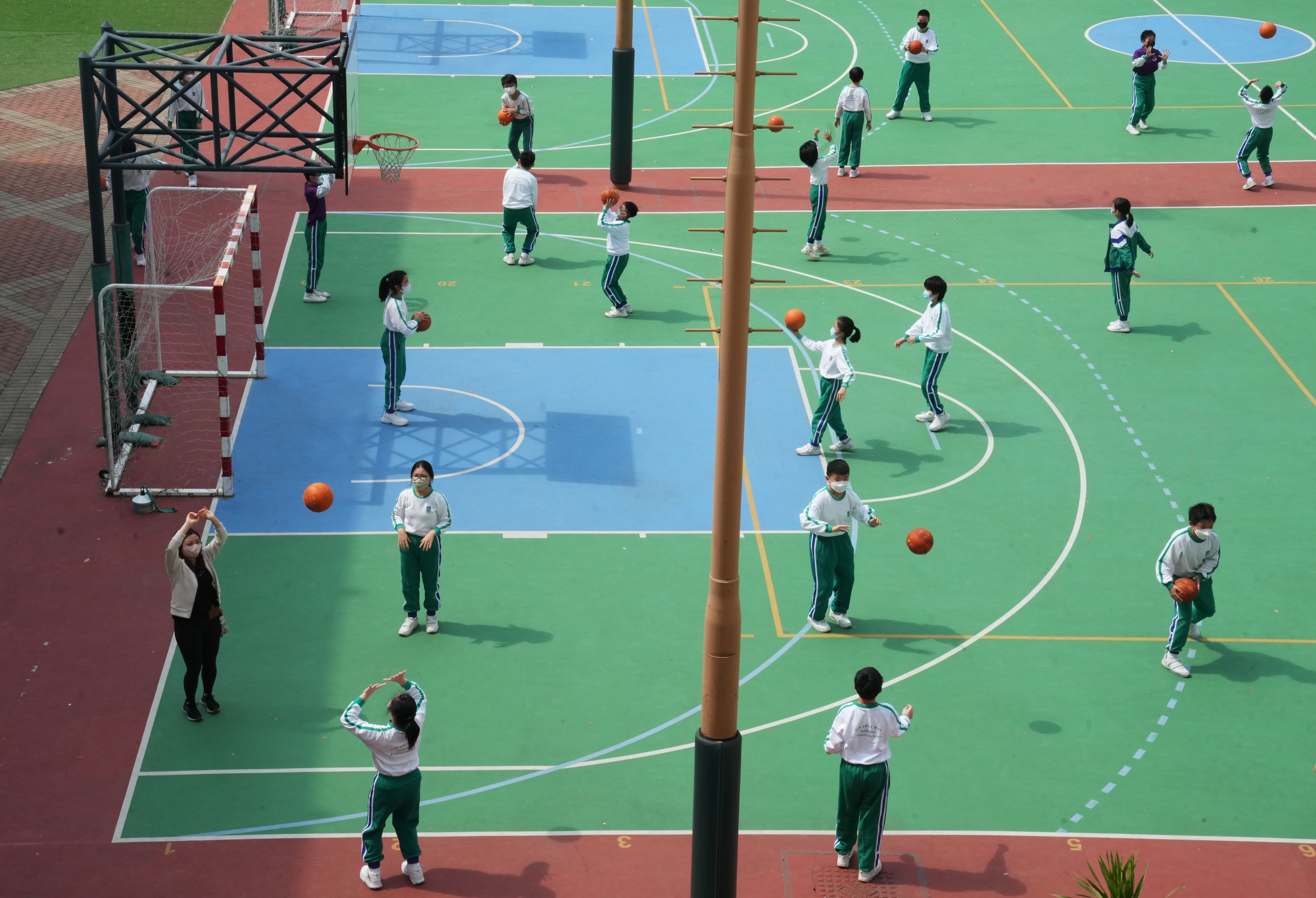 Students attend physical education class at Tin Shui Wai Methodist Primary School. Photo: Sam Tsang