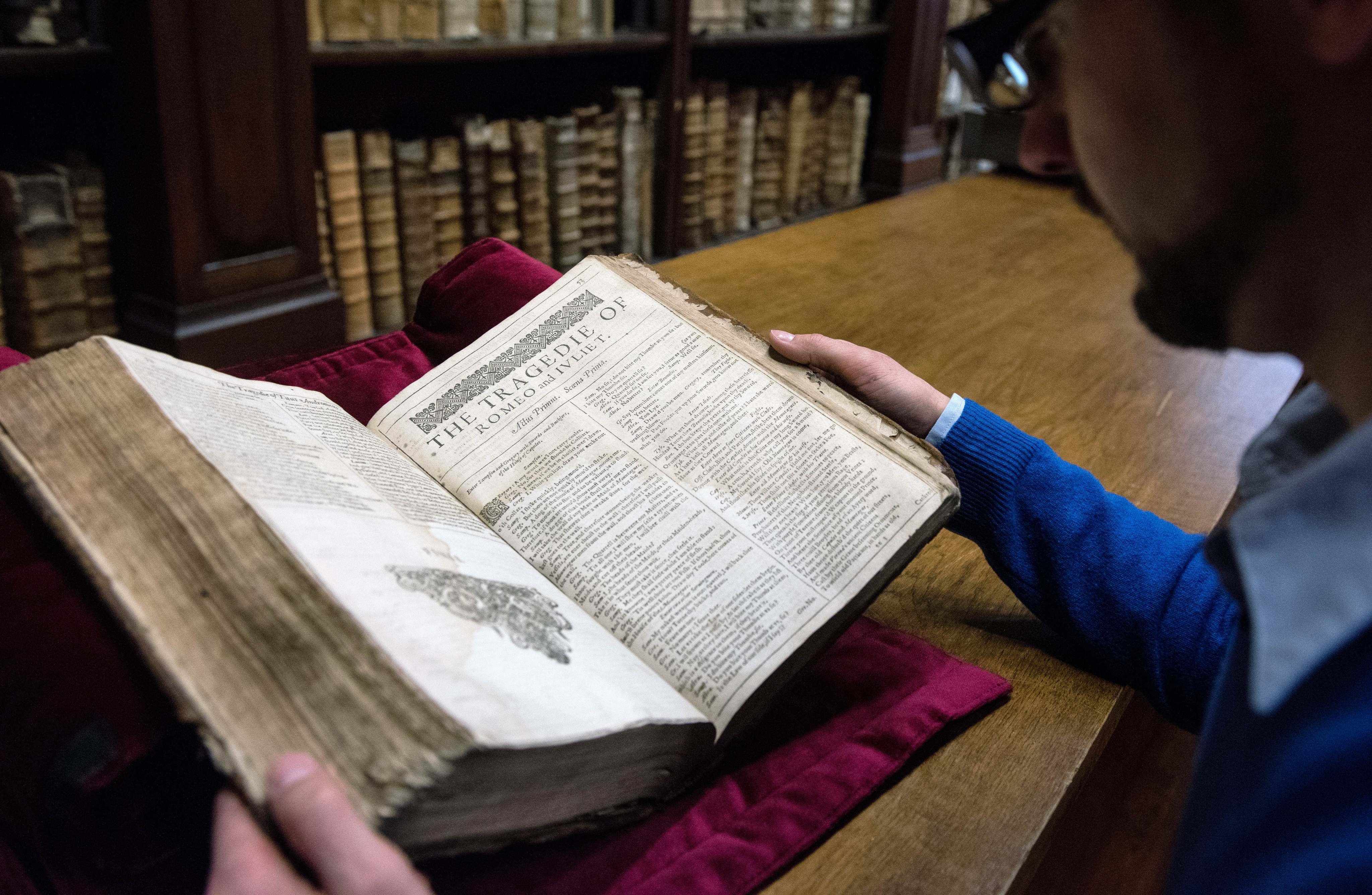 A librarian in the northern town of Saint-Omer, near Calais, carefully shows an example of a valuable Shakespeare “First Folio”, a collection of some of his plays, dating from 1623. Photo: AFP