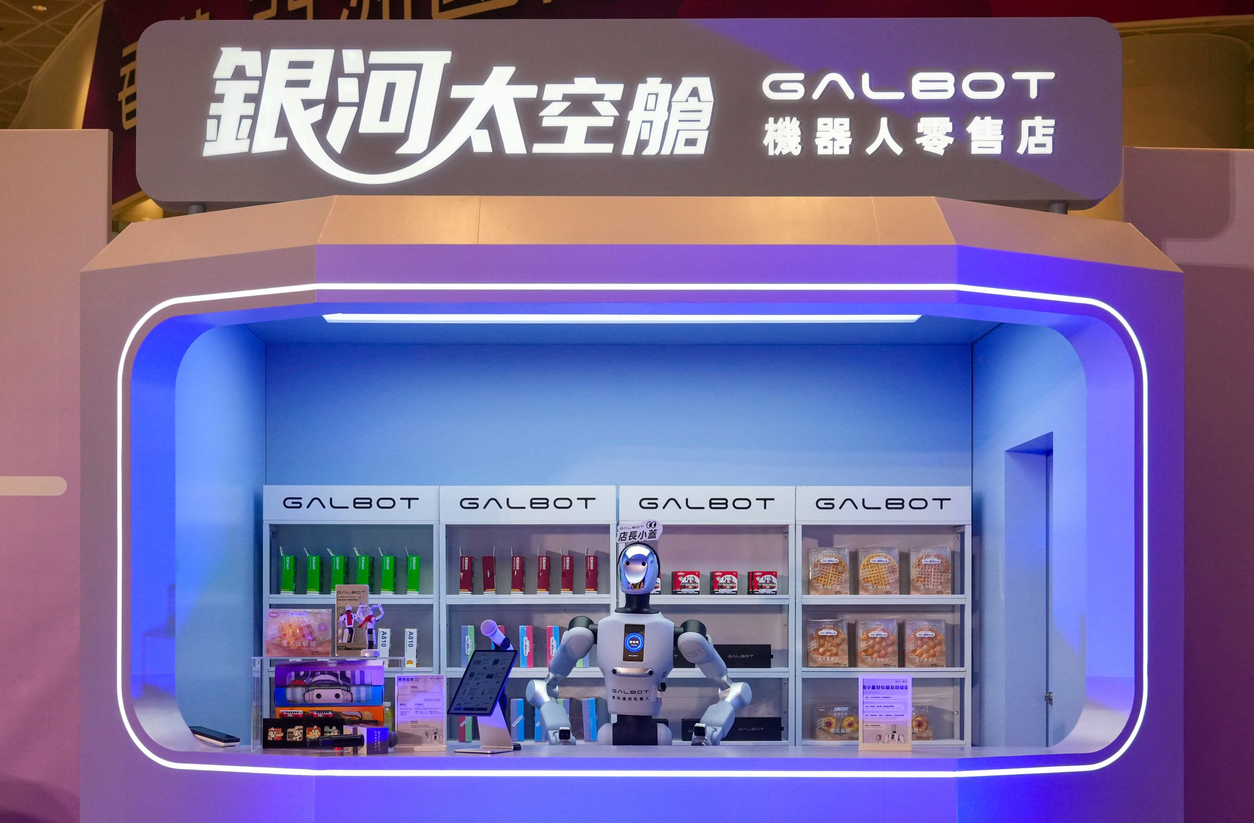 The robots can take orders, deliver goods and prepare drinks using a linked coffee machine. Photo: Karma Lo