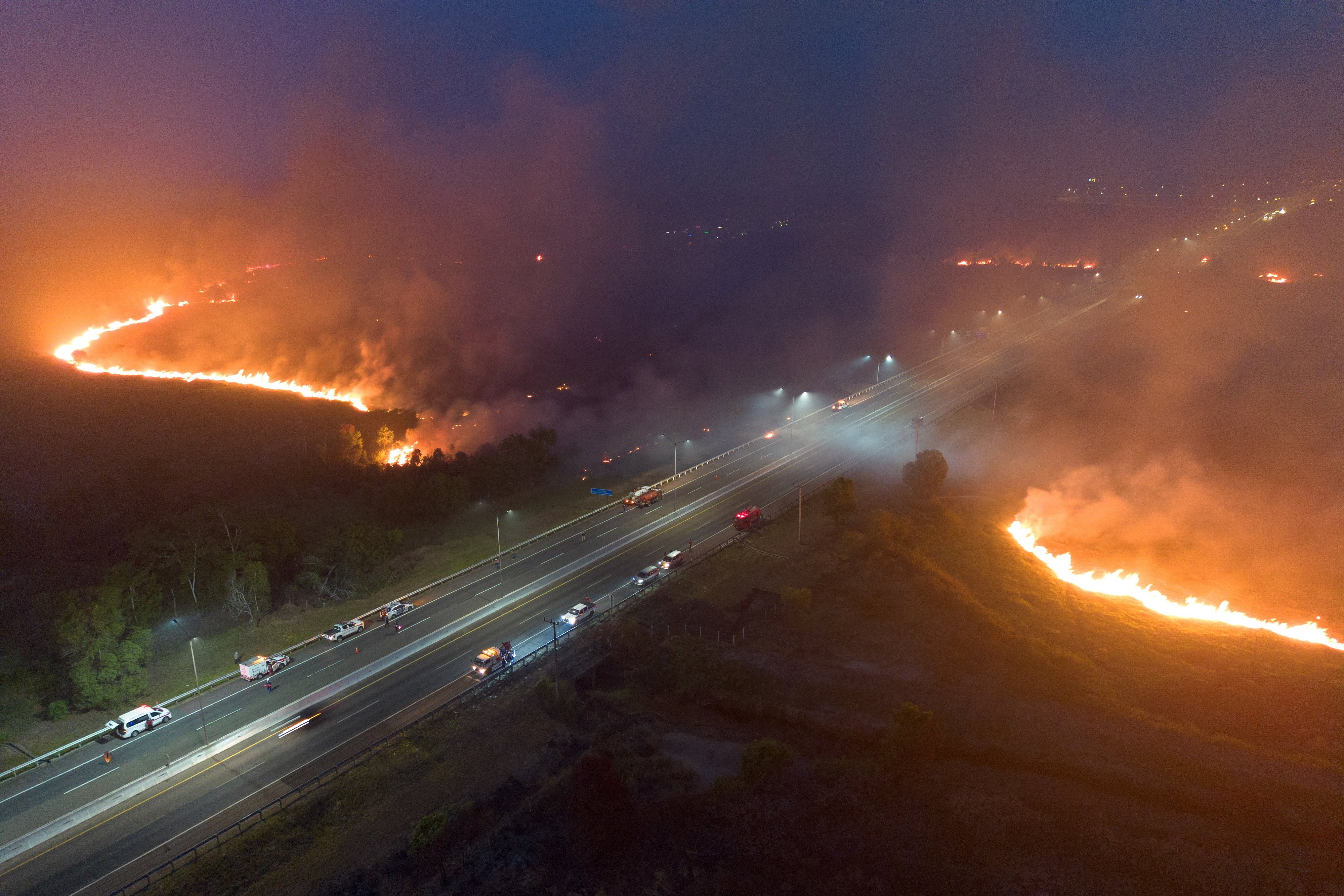 A drone view shows wildfires near a toll road in Ogan Ilir, Indonesia’s South Sumatra province, on Friday. Photo: Reuters