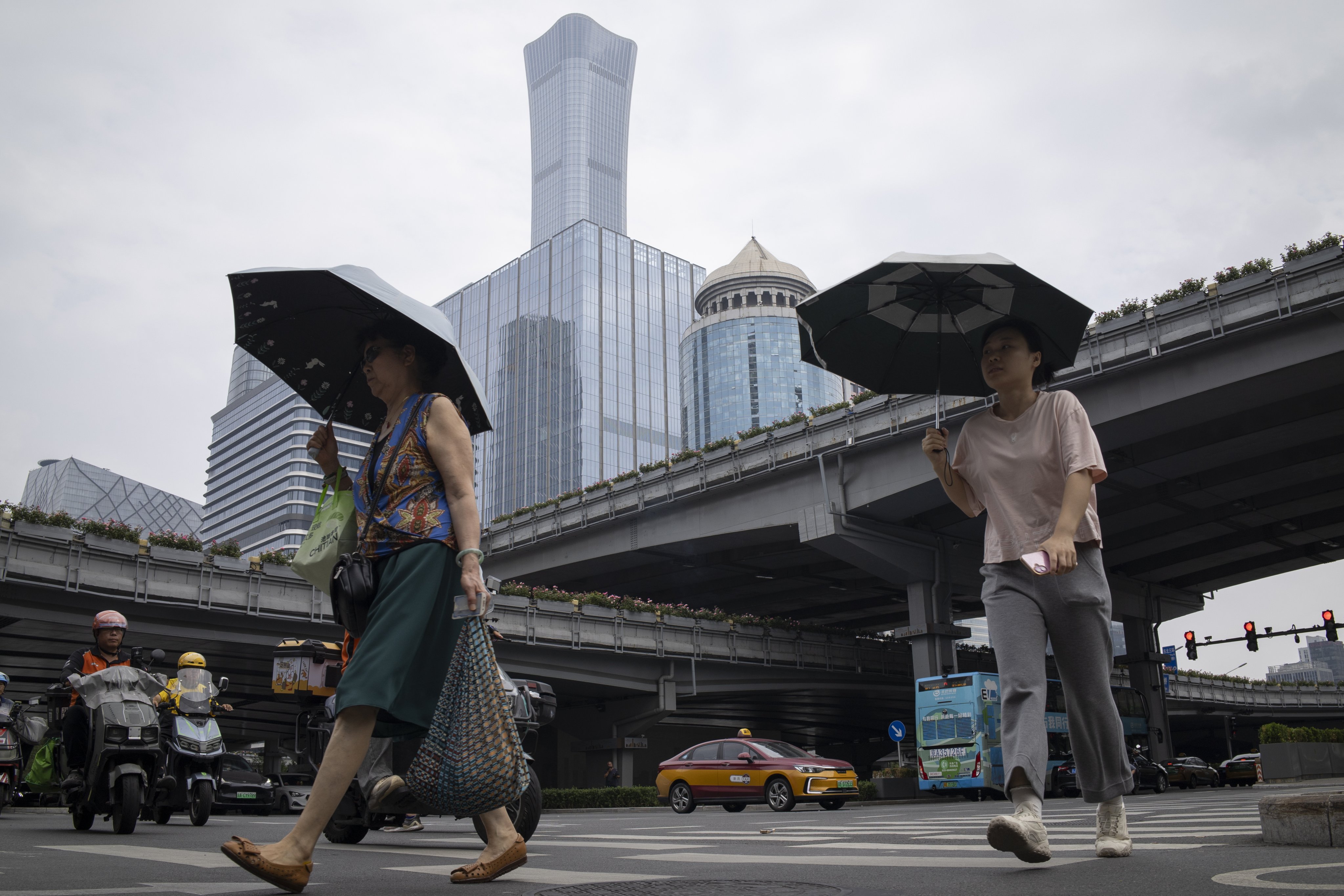 Women in Beijing’s central business district. Photo: EPA
