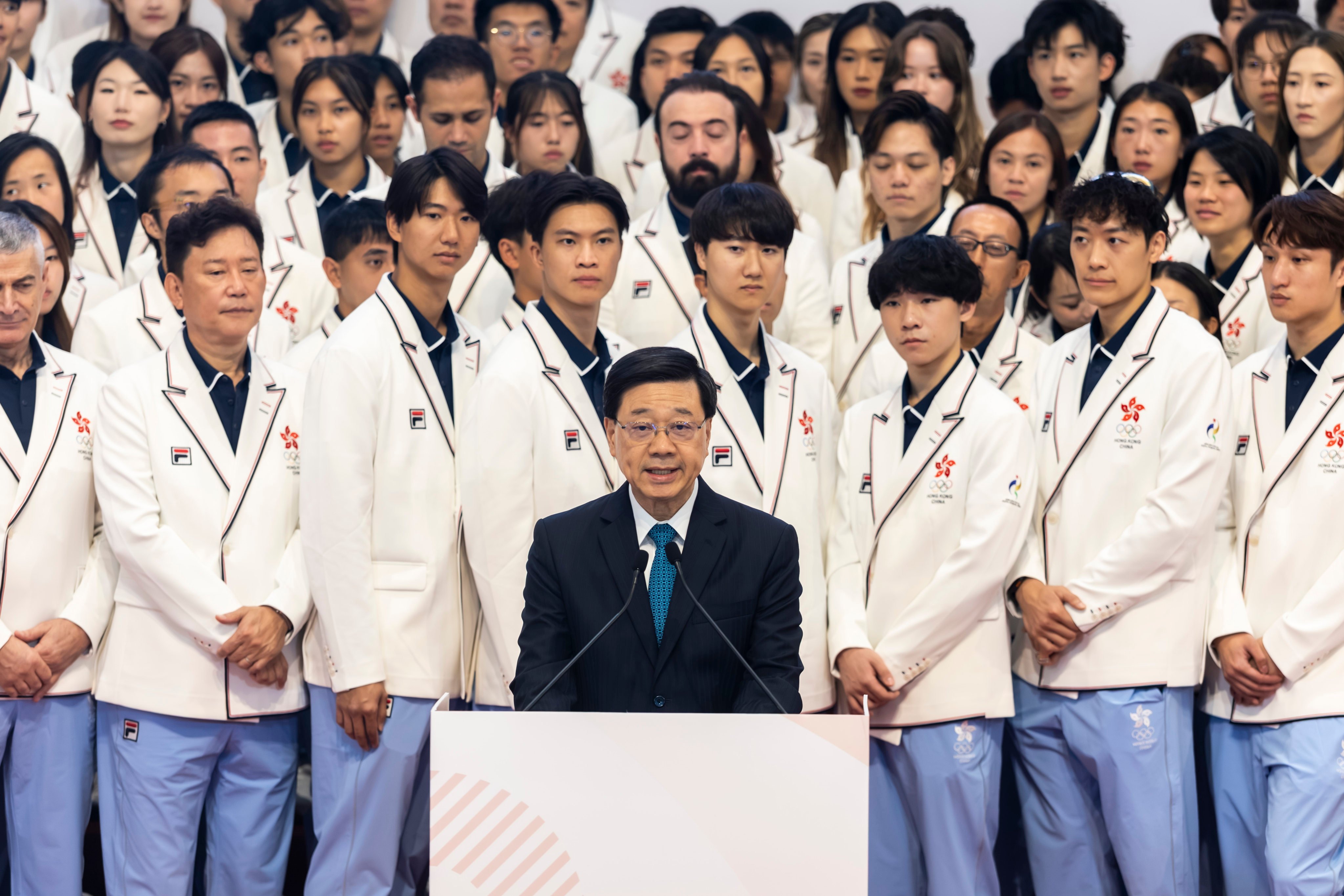 Hong Kong Chief Executive John Lee with members of the Hong Kong delegation at the presentation ceremony. Photo: SF&OC