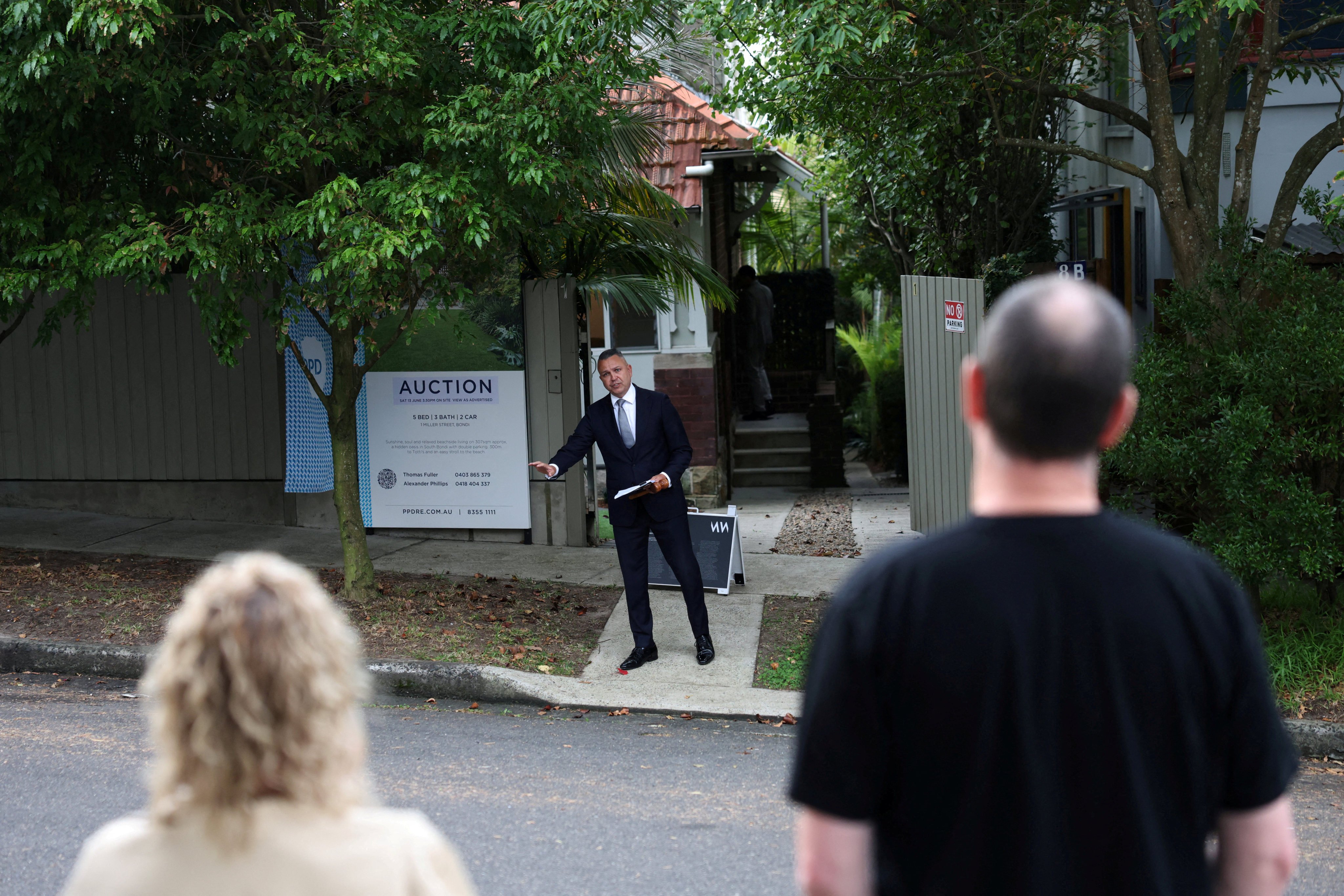 An auctioneer calls for bids during a property auction in Bondi, Sydney, on June 13. Photo: Reuters