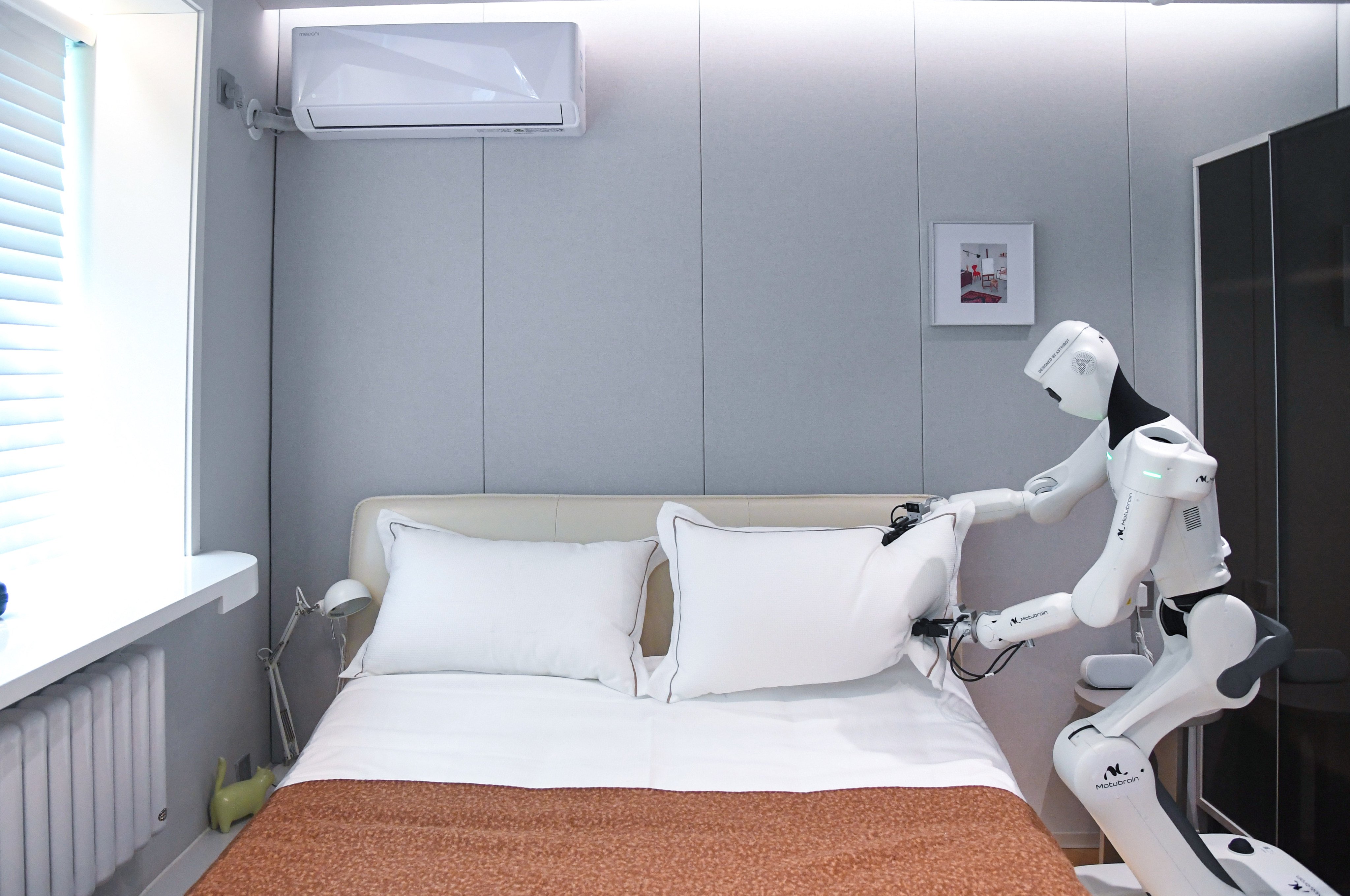 An embodied AI-powered robot undertakes household chores in Beijing. Photo: Xinhua