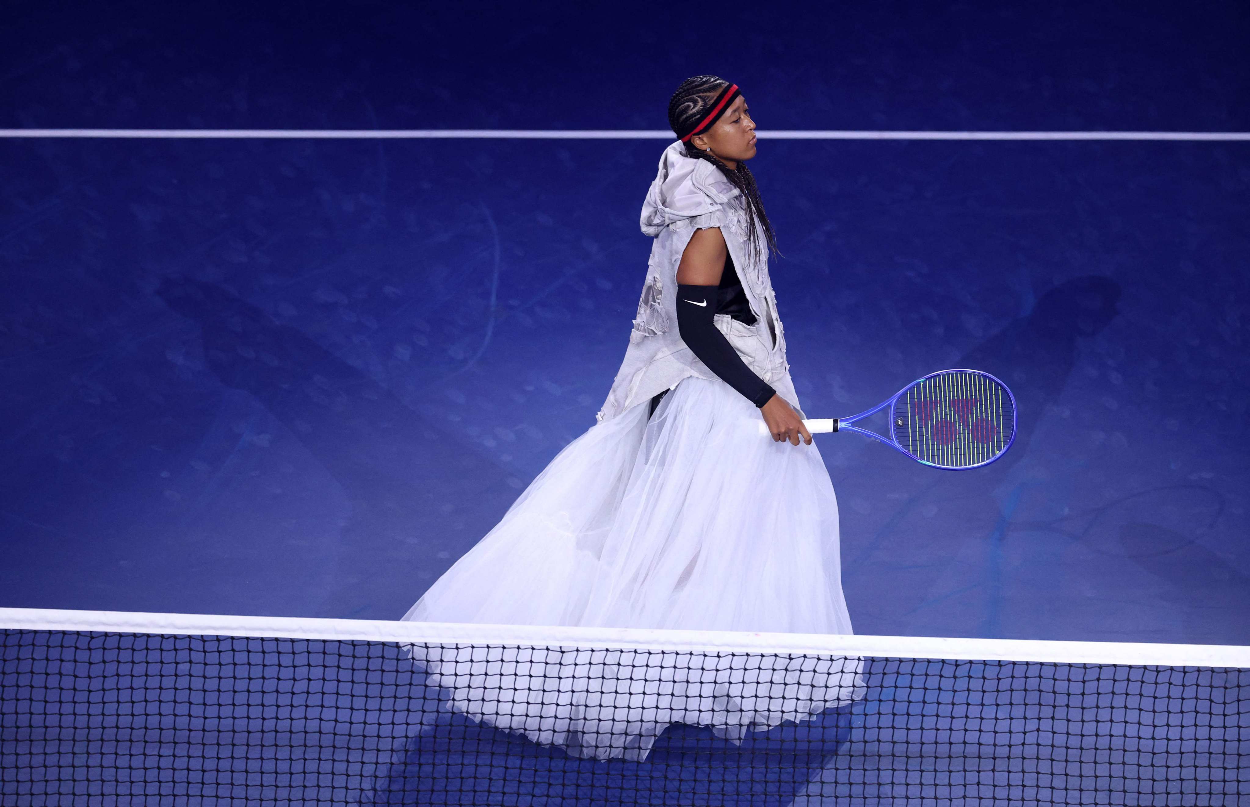 Naomi Osaka walks onto the court to face Anastasia Zakharova in their first-round match on day two of the US Open at USTA Billie Jean King National Tennis Center on Monday. Photo: AFP