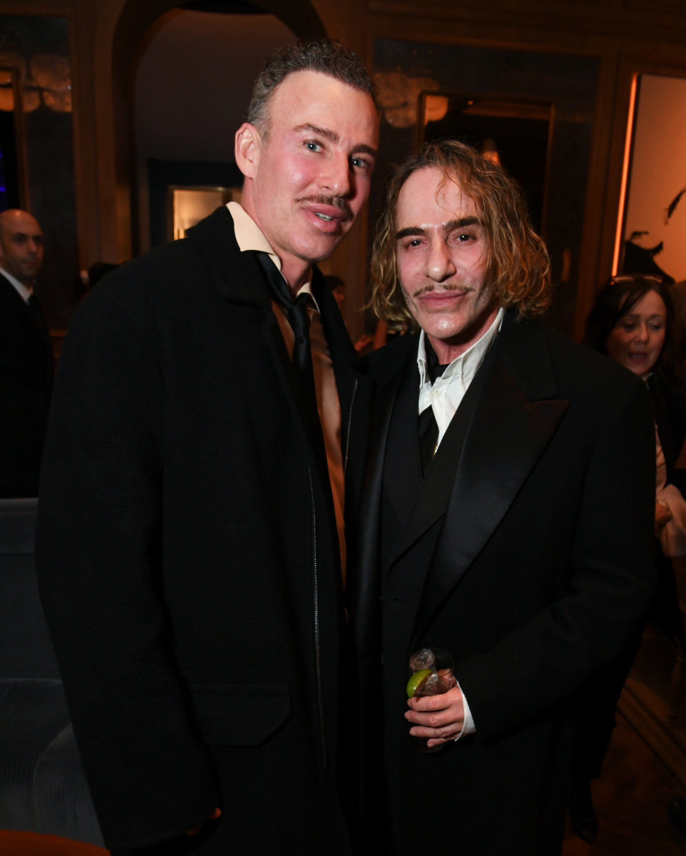 John Galliano (right) and his partner Alexis Roche at English columnist Meg Mathews’ 60th birthday in London in March. Photo: Getty Images