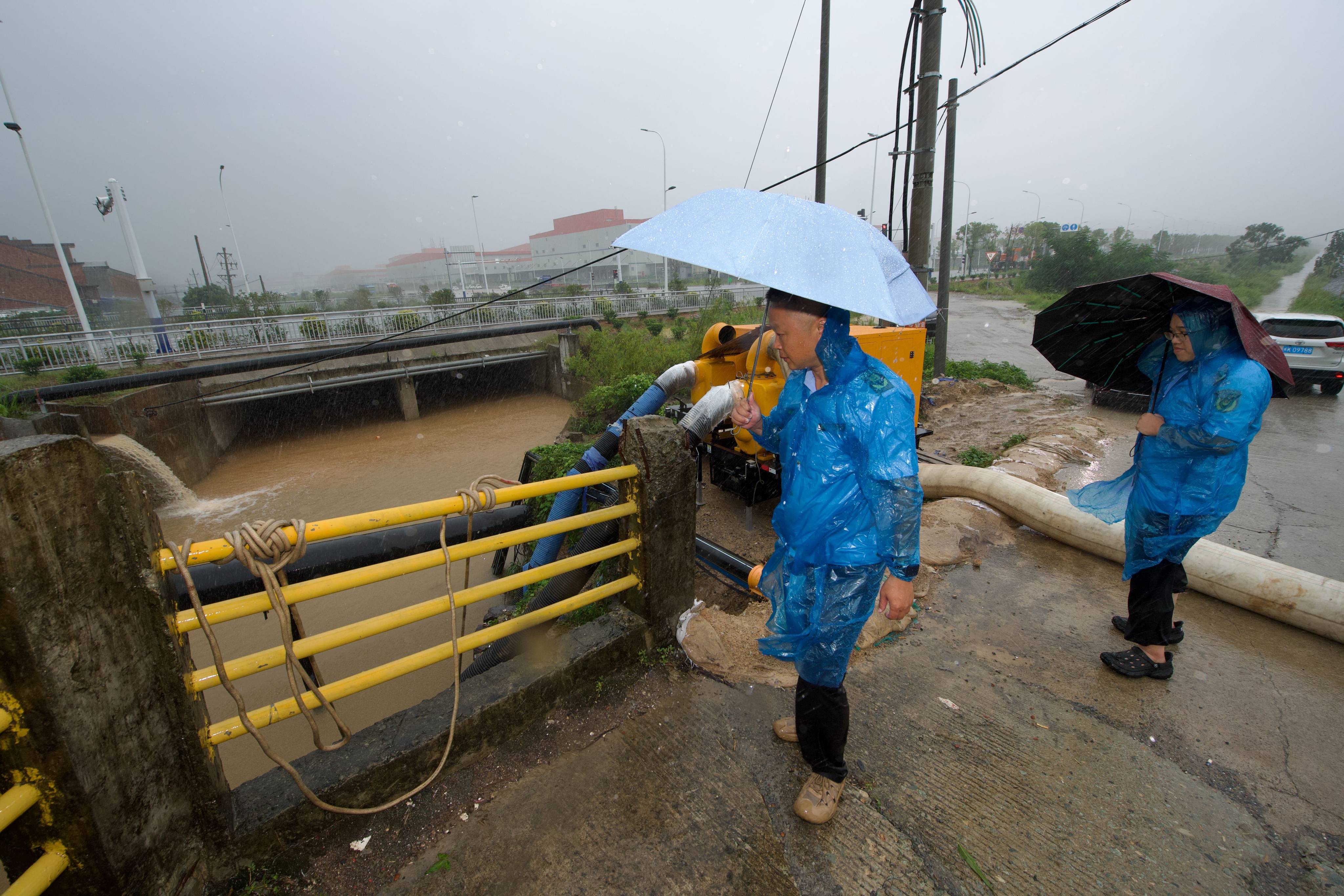 Officials inspect draining pipes in Fuding in China’s southeastern Fujian province on Friday. Photo: Xinhua