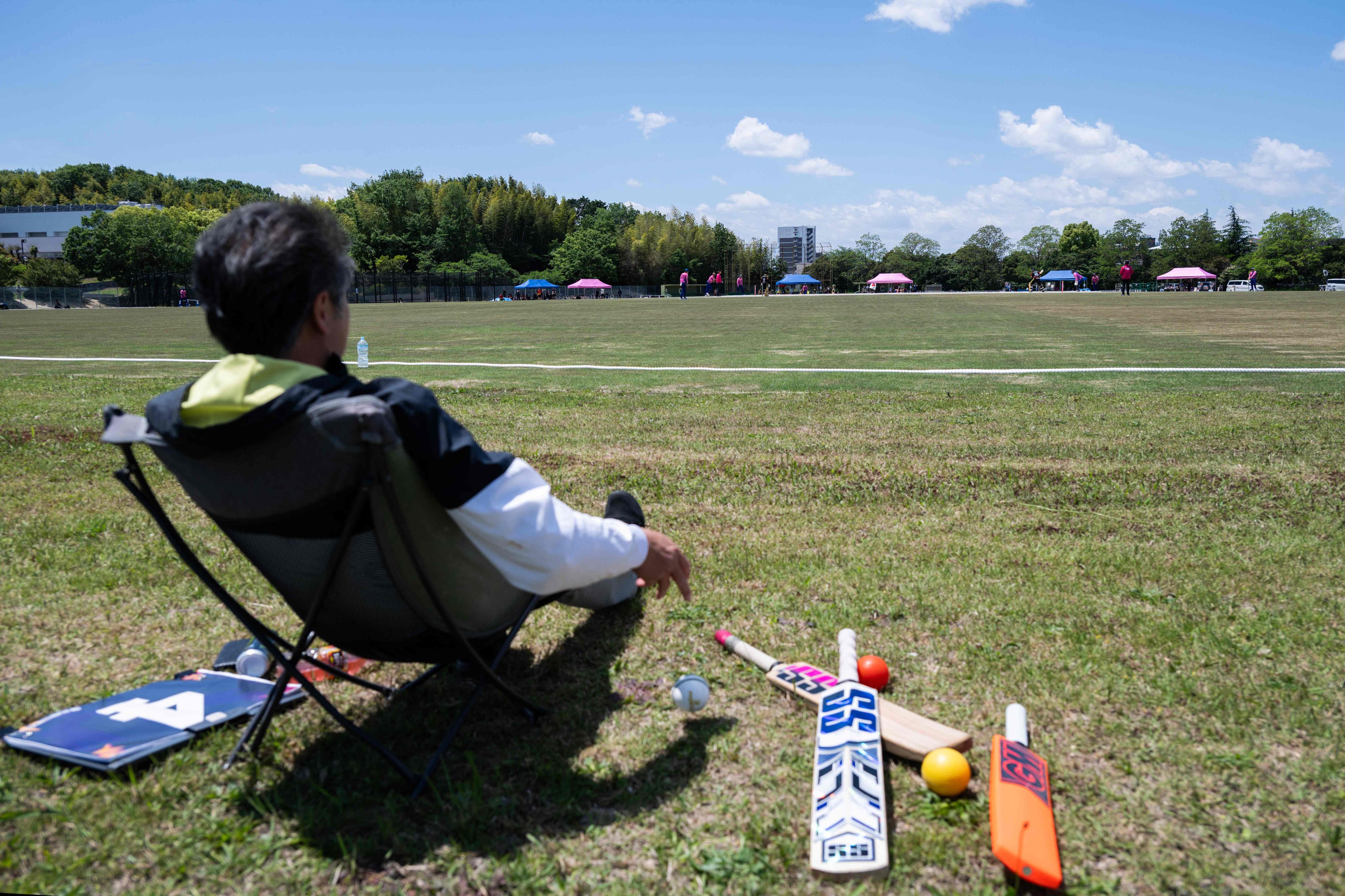 A spectator watches a game between Japan and Vanuatu at the new Nisshin Cricket Ground, which will hosts matches at the Asian Games. Photo: AFP