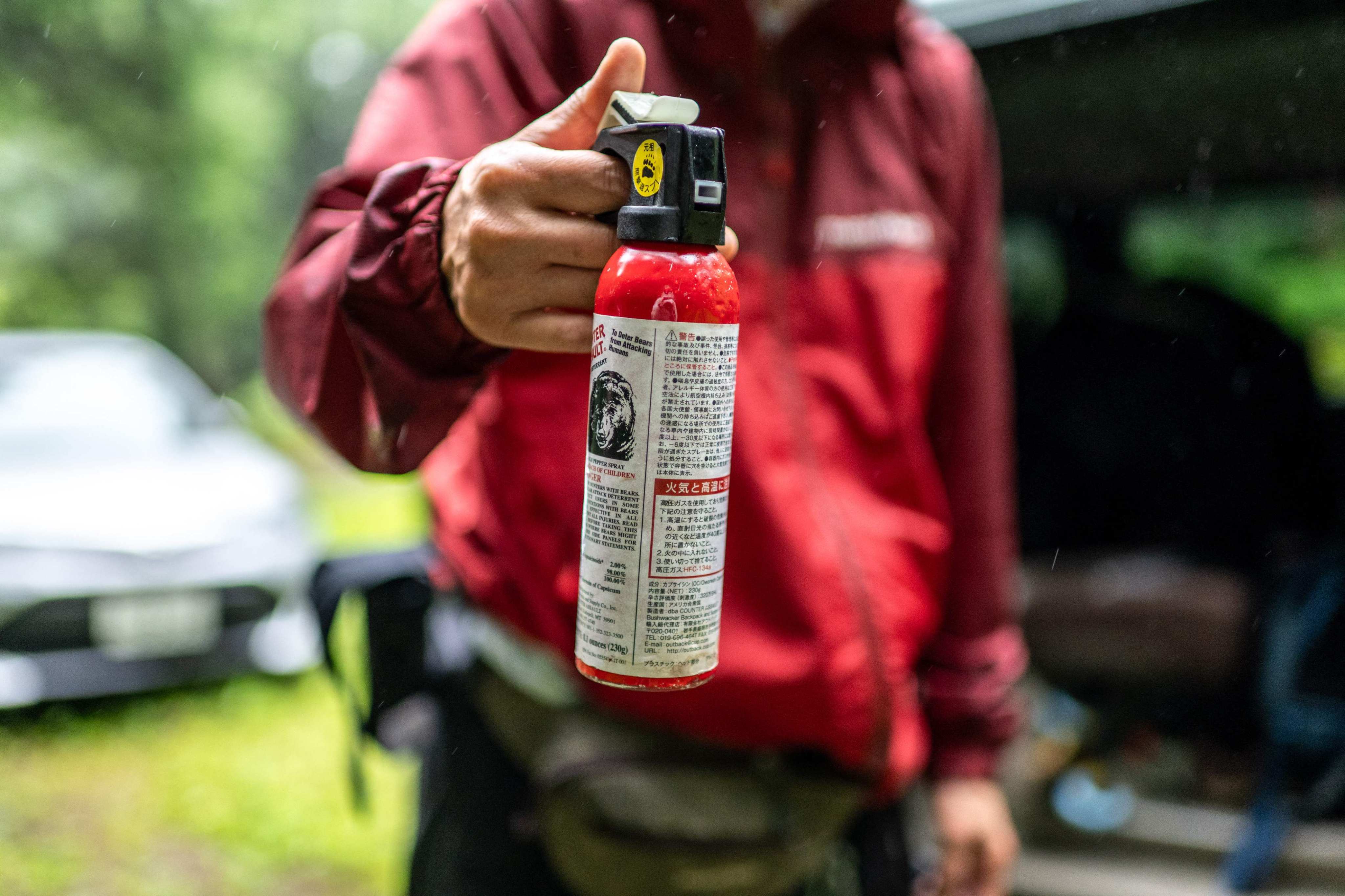 Akiko Takii shows a can of bear spray that she carries for safety while entering forests in Ina, Nagano prefecture, on July 6. Photo: AFP