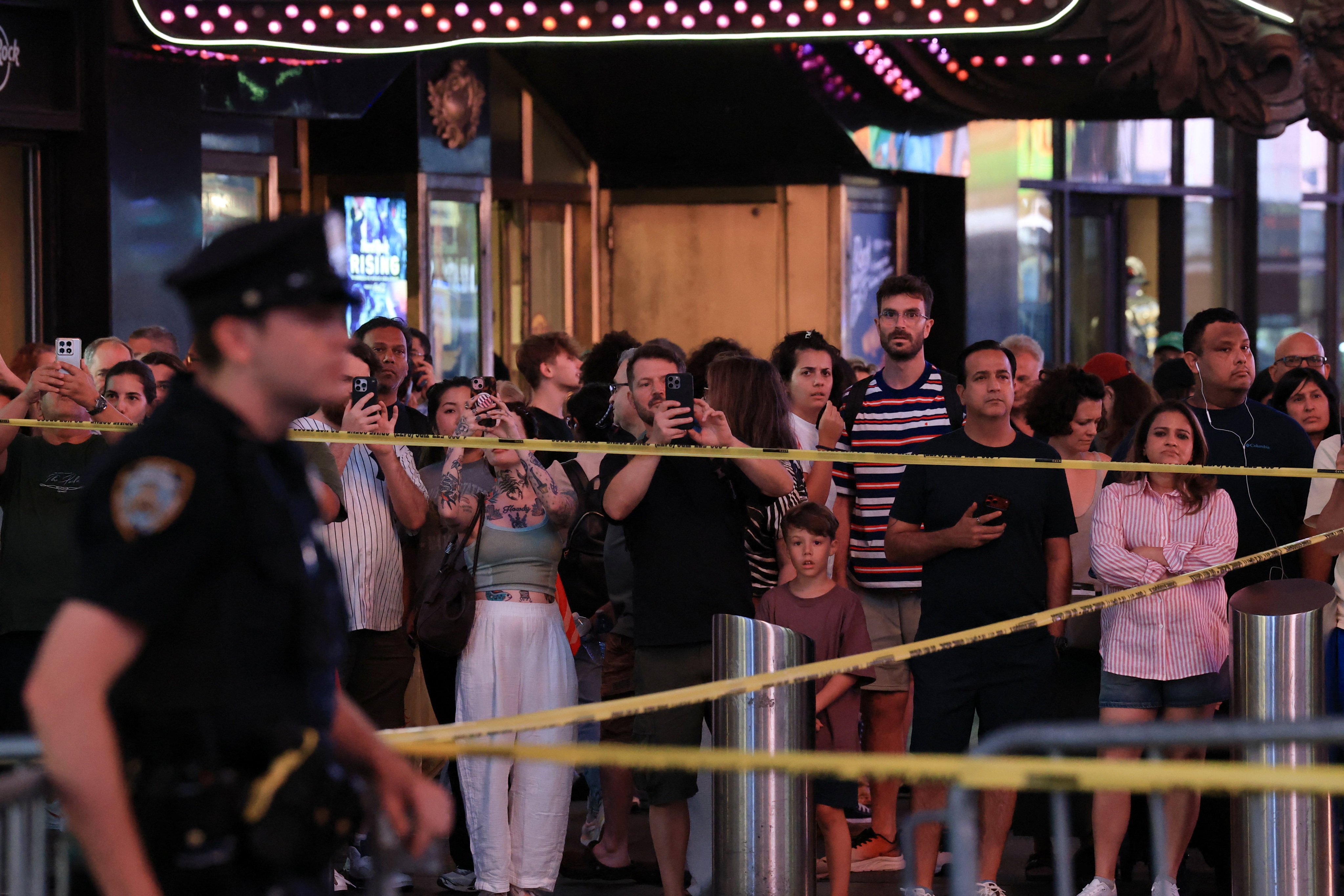 People gather as NYPD Commissioner Jessica Tisch and New York City Mayor Zohran Mamdani hold a press conference at the scene. Photo: Reuters