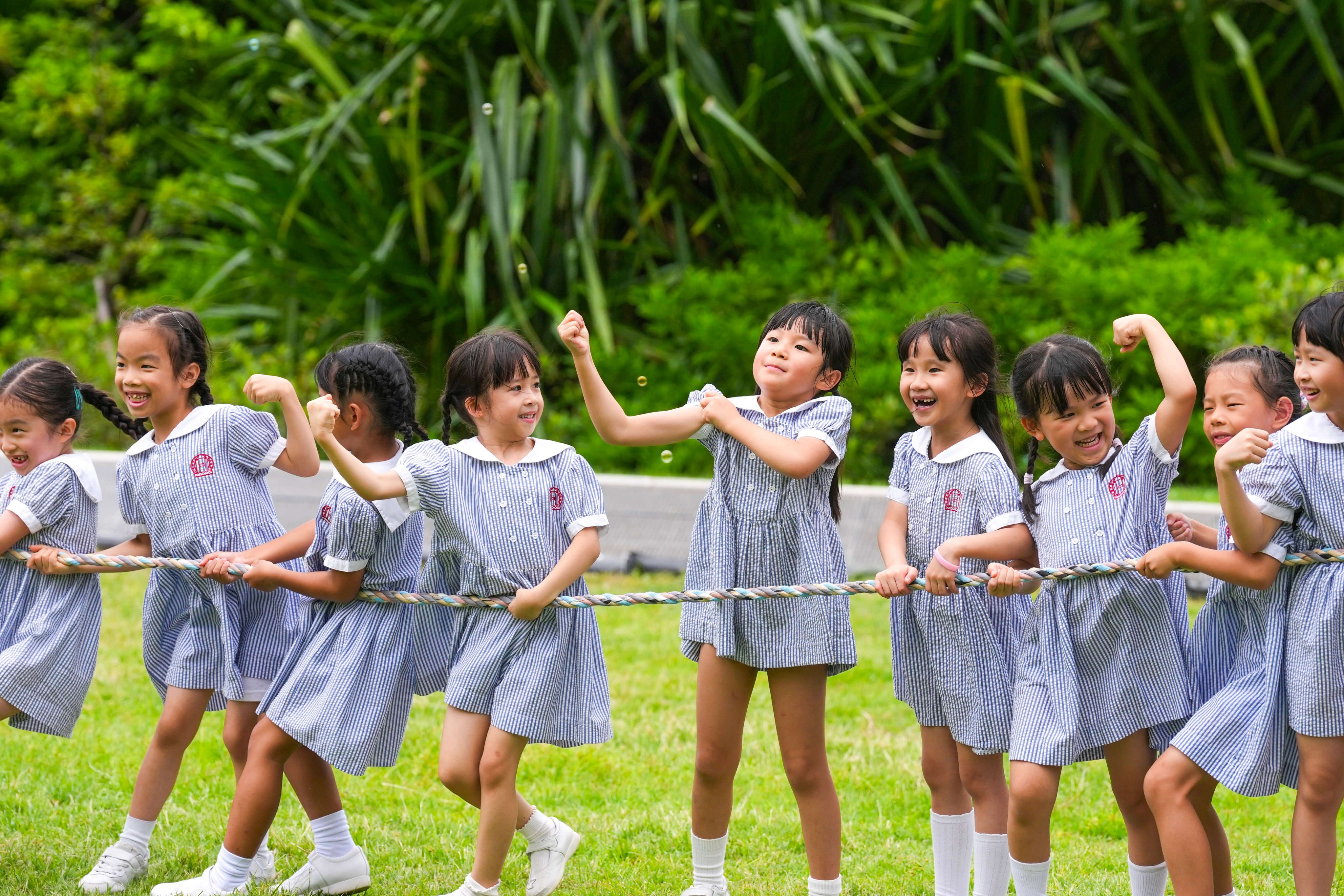 Pupils play tug-of-war at West Kowloon Cultural District. The total number of Primary One classes across public schools dropped from 1,558 in 2025-26 to 1,432 in 2026-27. Photo: Karma Lo