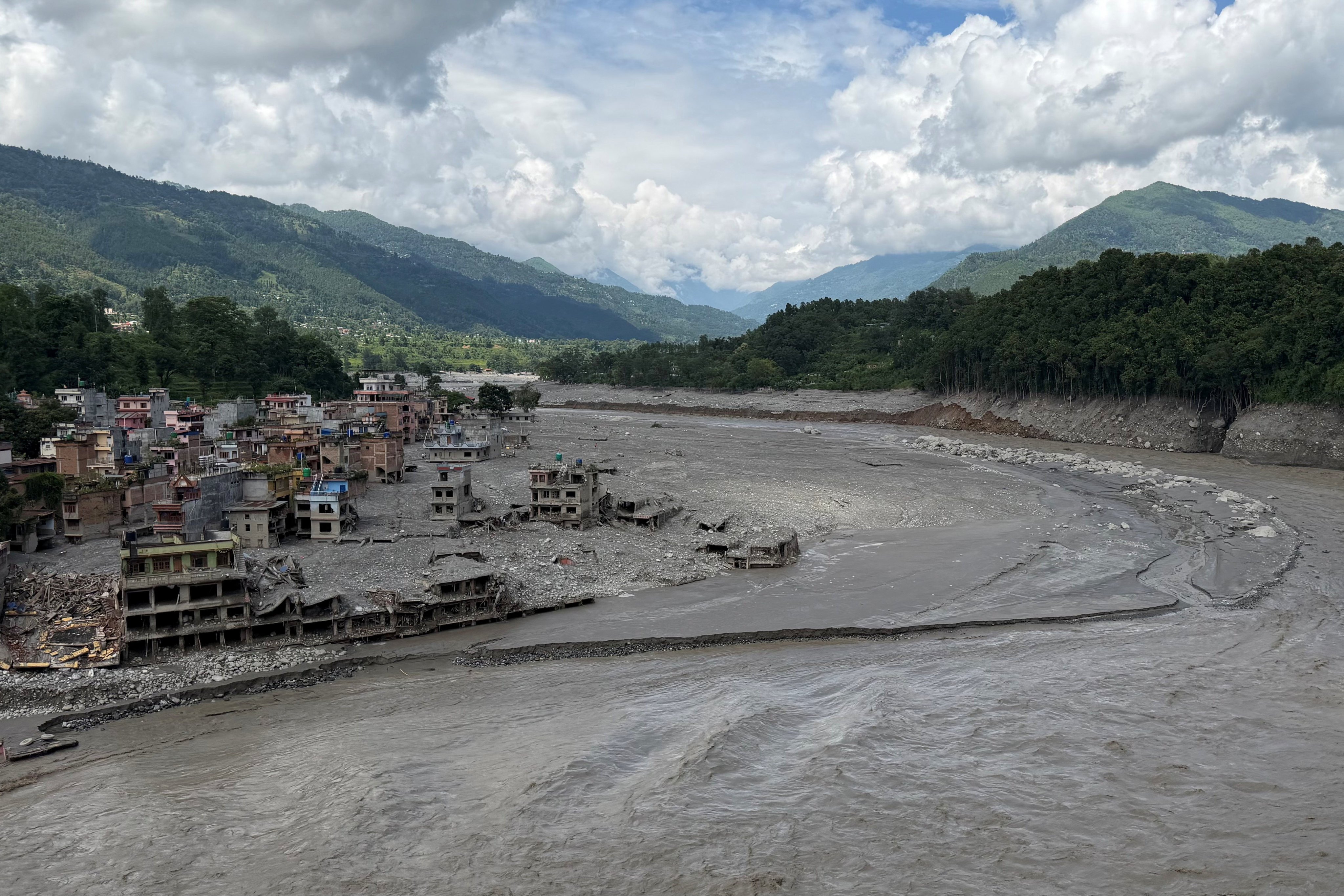 Damaged buildings are seen where the Tribhuvan Trishuli Secondary School once stood along the Trishuli River on Friday. Photo: Reuters