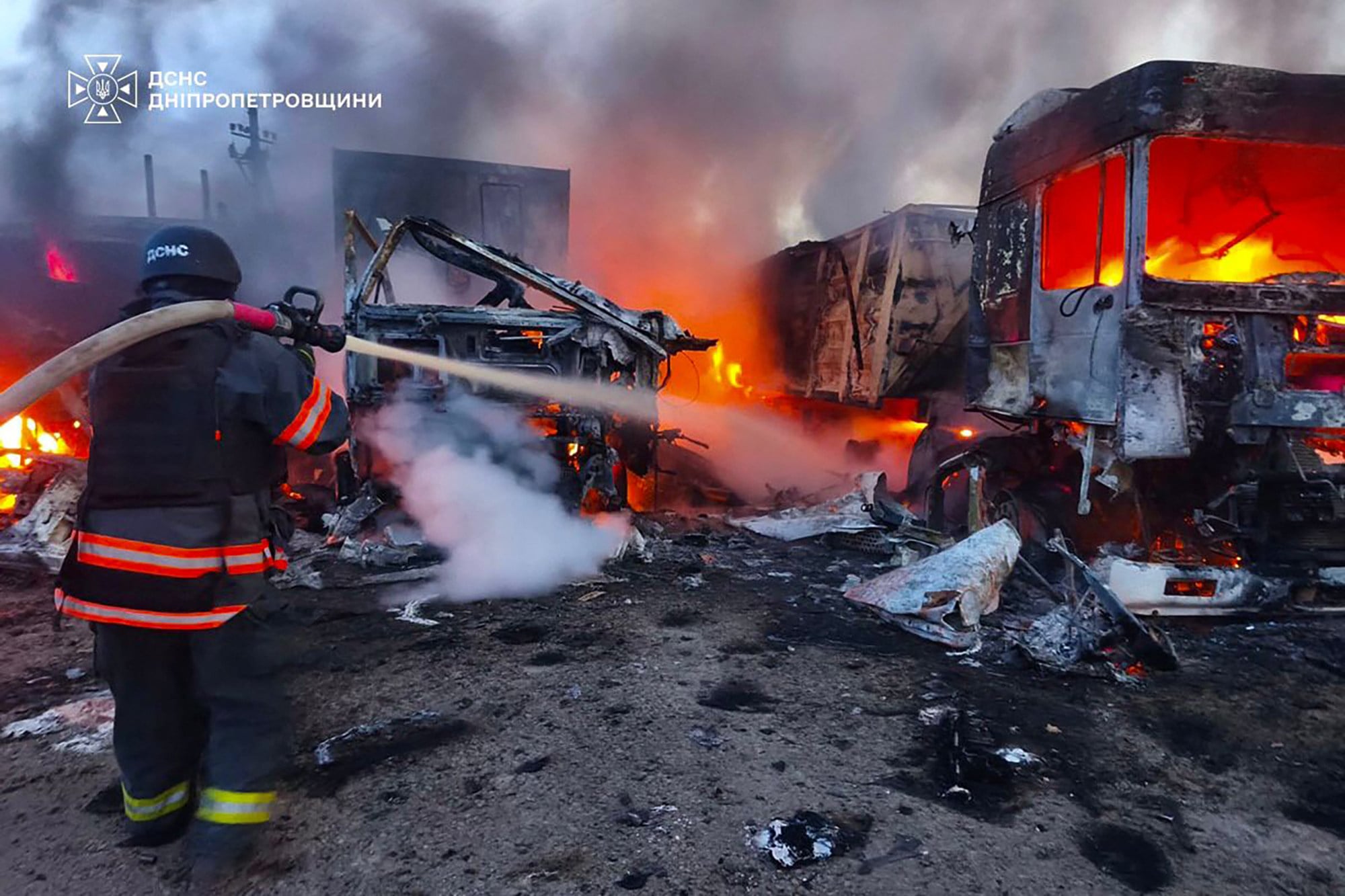 A Ukrainian rescuer works to extinguish a fire at the site of an air attack at an undisclosed location in the Dnipro region, amid the Russian invasion of Ukraine on Wednesday. Photo: Ukrainian Emergency Service / AFP
