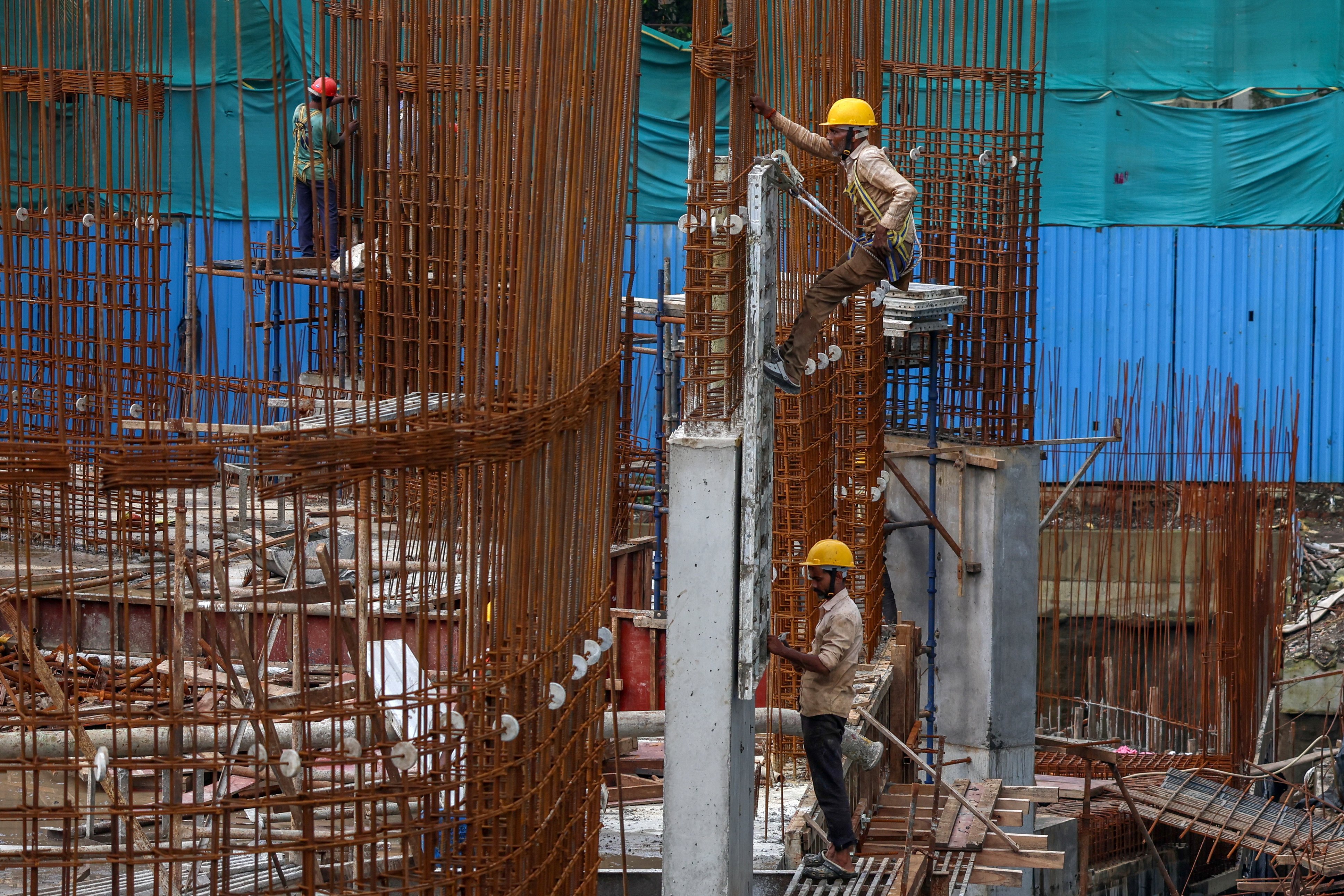 Labourers work at a construction site in Mumbai, India, last month. Photo: EPA