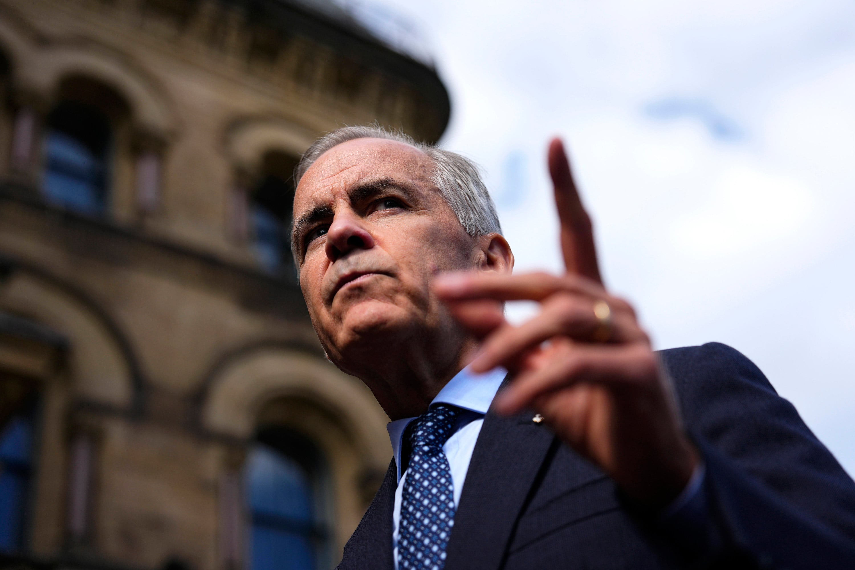 Canadian Prime Minister Mark Carney speaks with members of the media as he arrives at the Office of the Prime Minister and Privy Council in Ottawa on Tuesday. Photo: The Canadian Press via AP