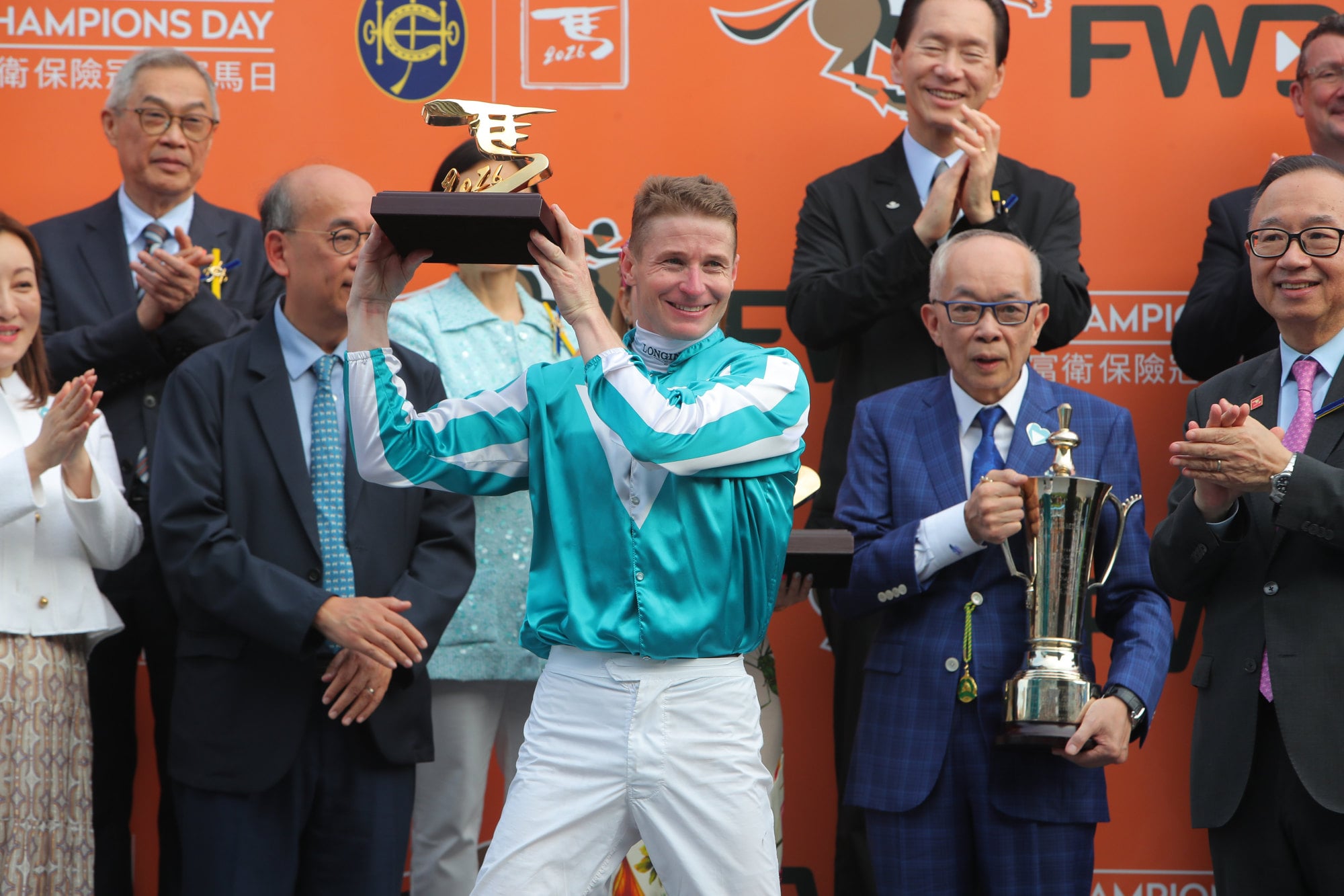 Jockey James McDonald and owner Peter Lau with the QE II Cup trophies after Romantic Warrior’s win earlier this year. Jockey James McDonald and owner Peter Lau with the QE II Cup trophies after Romantic Warrior’s win earlier this year.