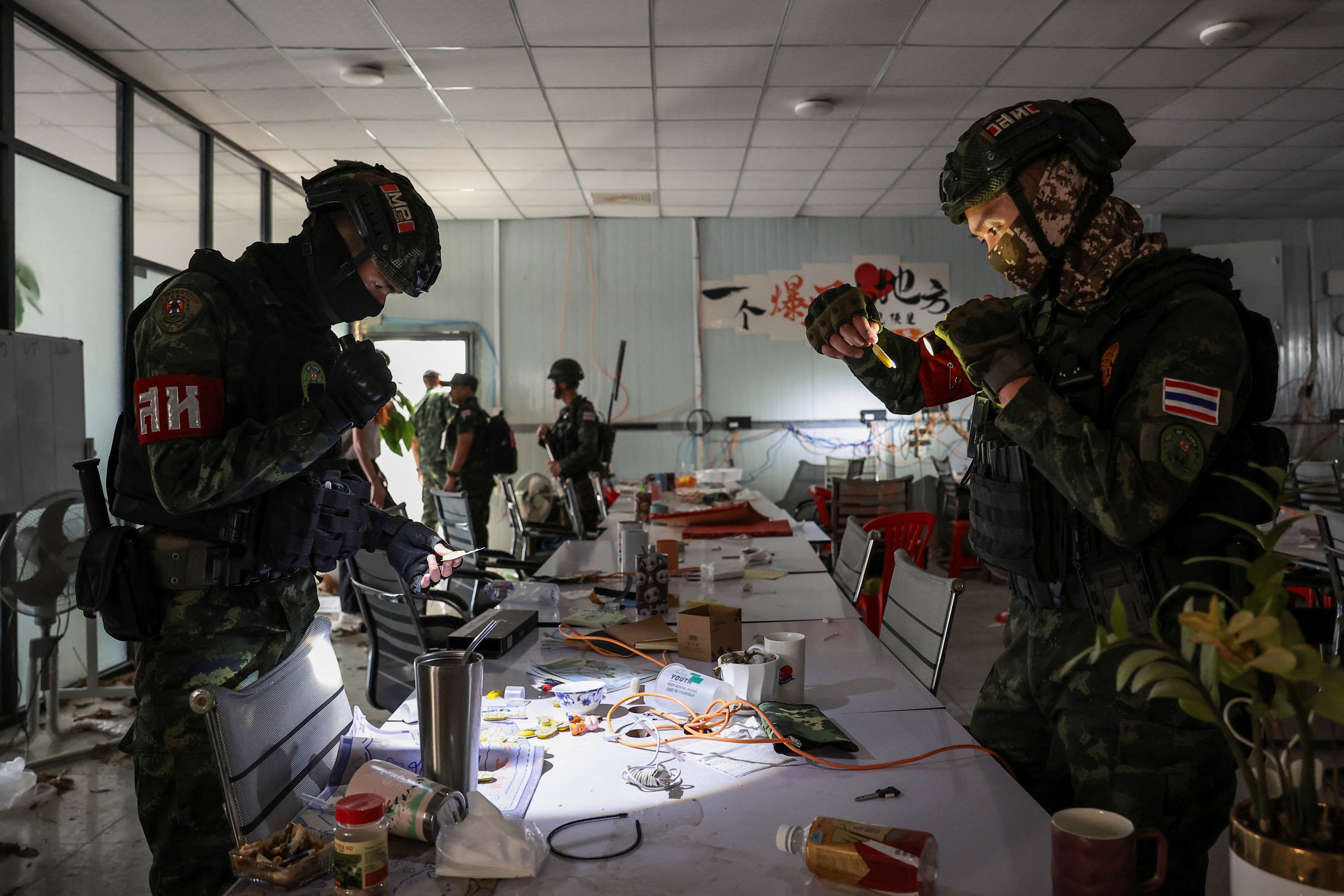 Thai soldiers inspect a workstation at a suspected scam compound near the Chong Chom-O’Smach border crossing with Cambodia in December. Photo: Reuters