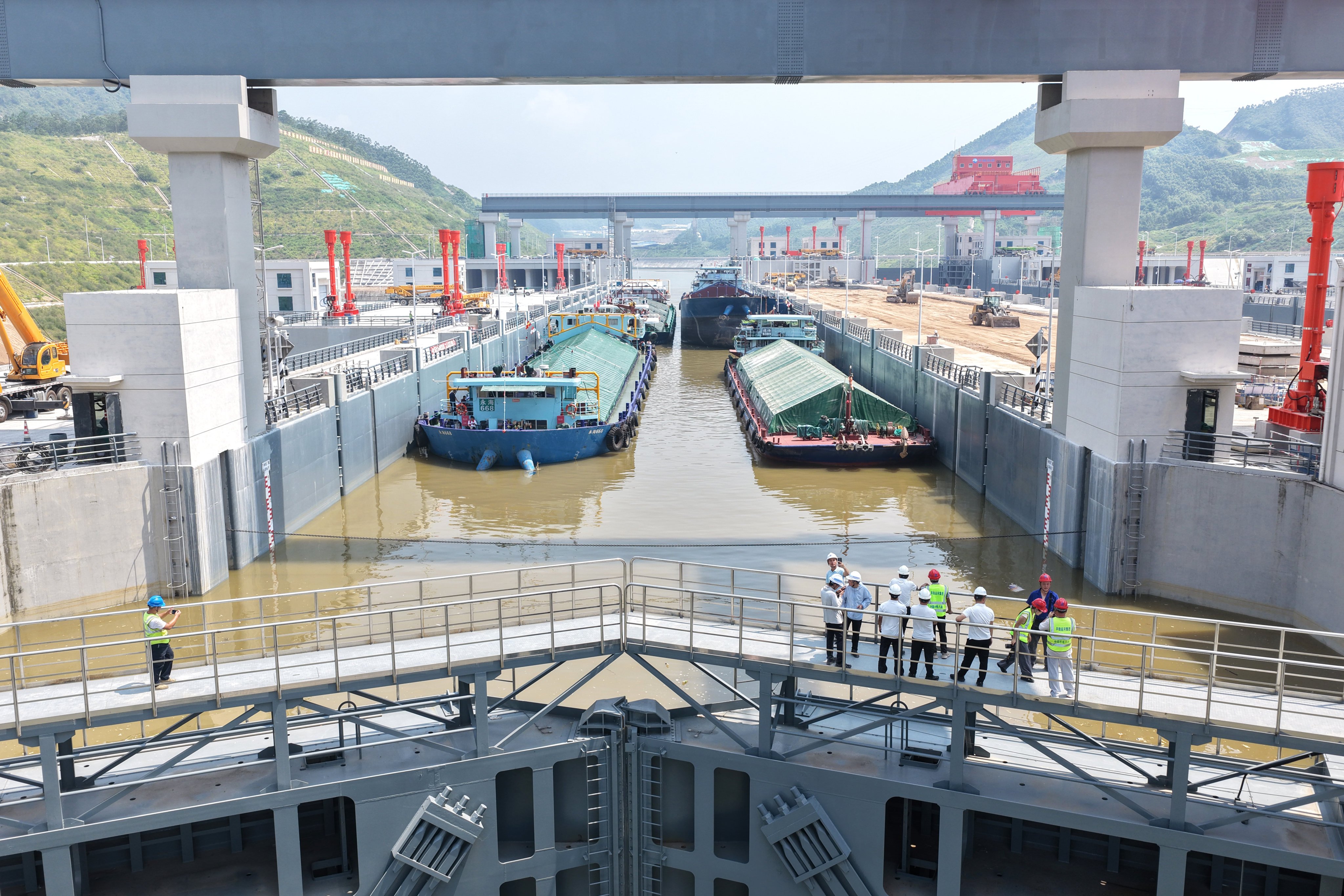 Trial vessels are seen at a navigation lock on the Pinglu Canal in China’s Guangxi Zhuang autonomous region on August 12. Photo: Xinhua