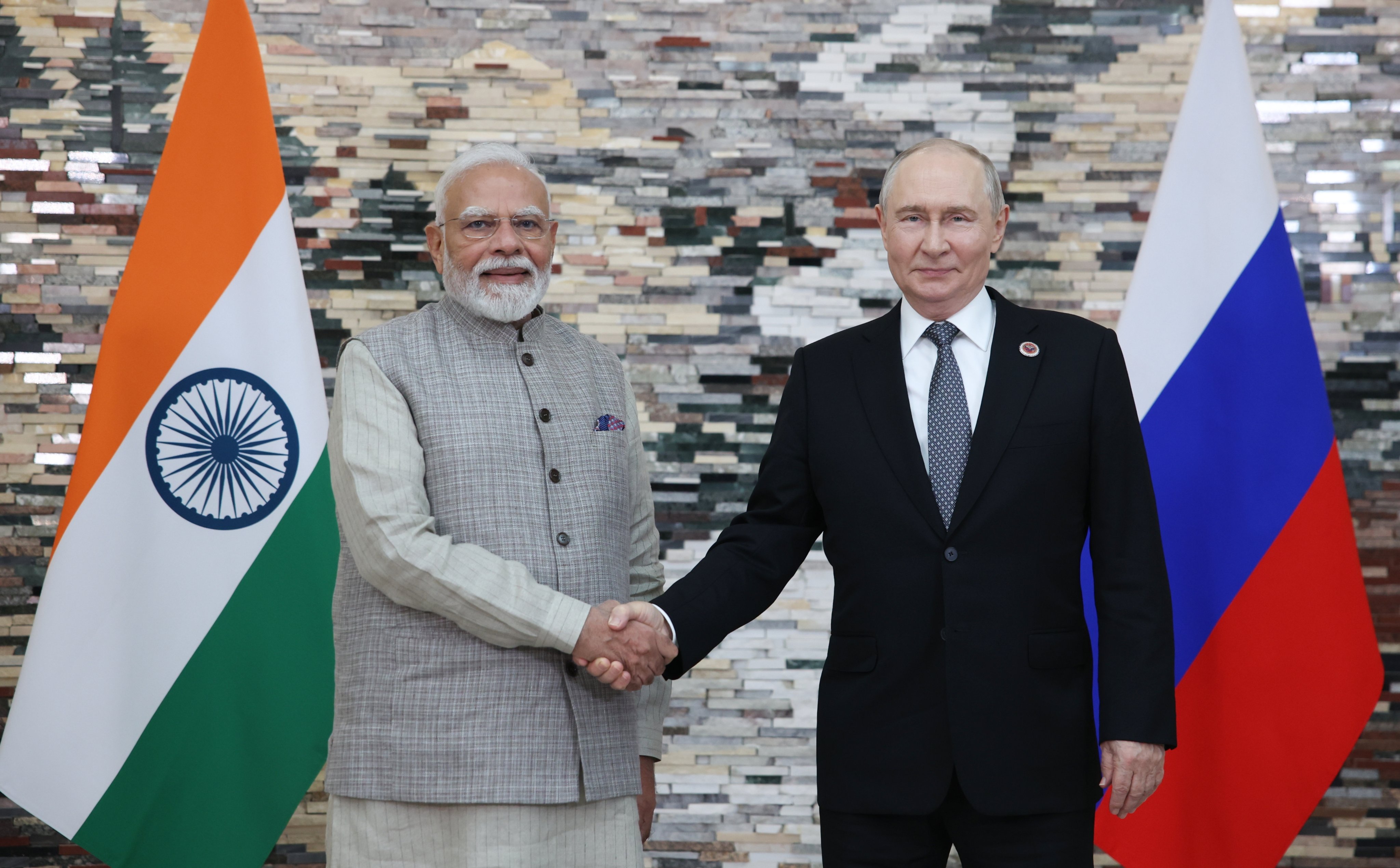 Indian Prime Minister Narendra Modi (left) and Russian President Vladimir Putin shake hands at the Shanghai Cooperation Organisation summit in Bishkek, Kyrgyzstan, on Monday. Photo: EPA