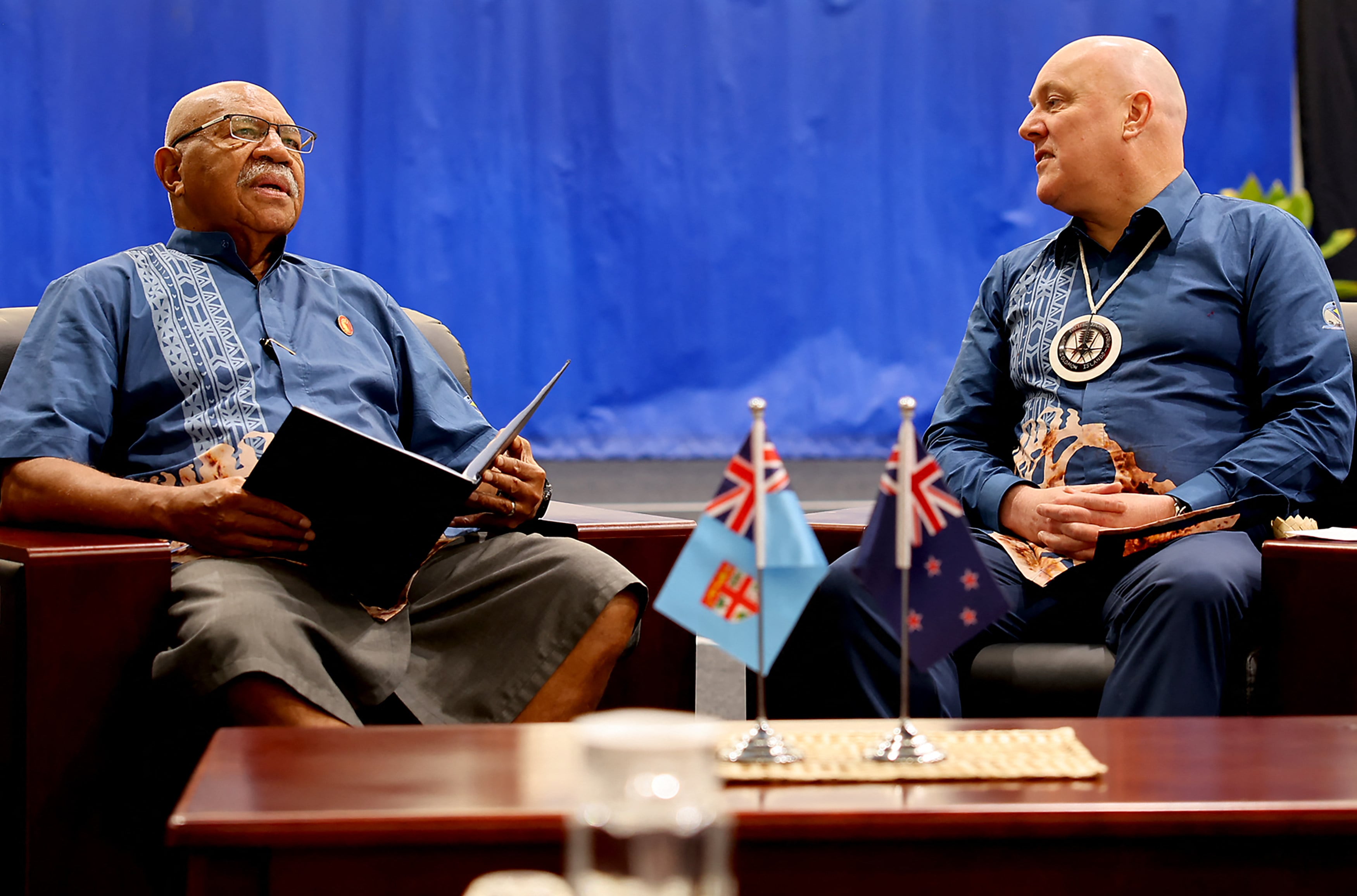New Zealand’s Prime Minister Christopher Luxon (right) holds a meeting with Fijian counterpart Sitiveni Rabuka on the sidelines of the Pacific Islands Forum summit in the Solomon Islands last year. Photo: AFP