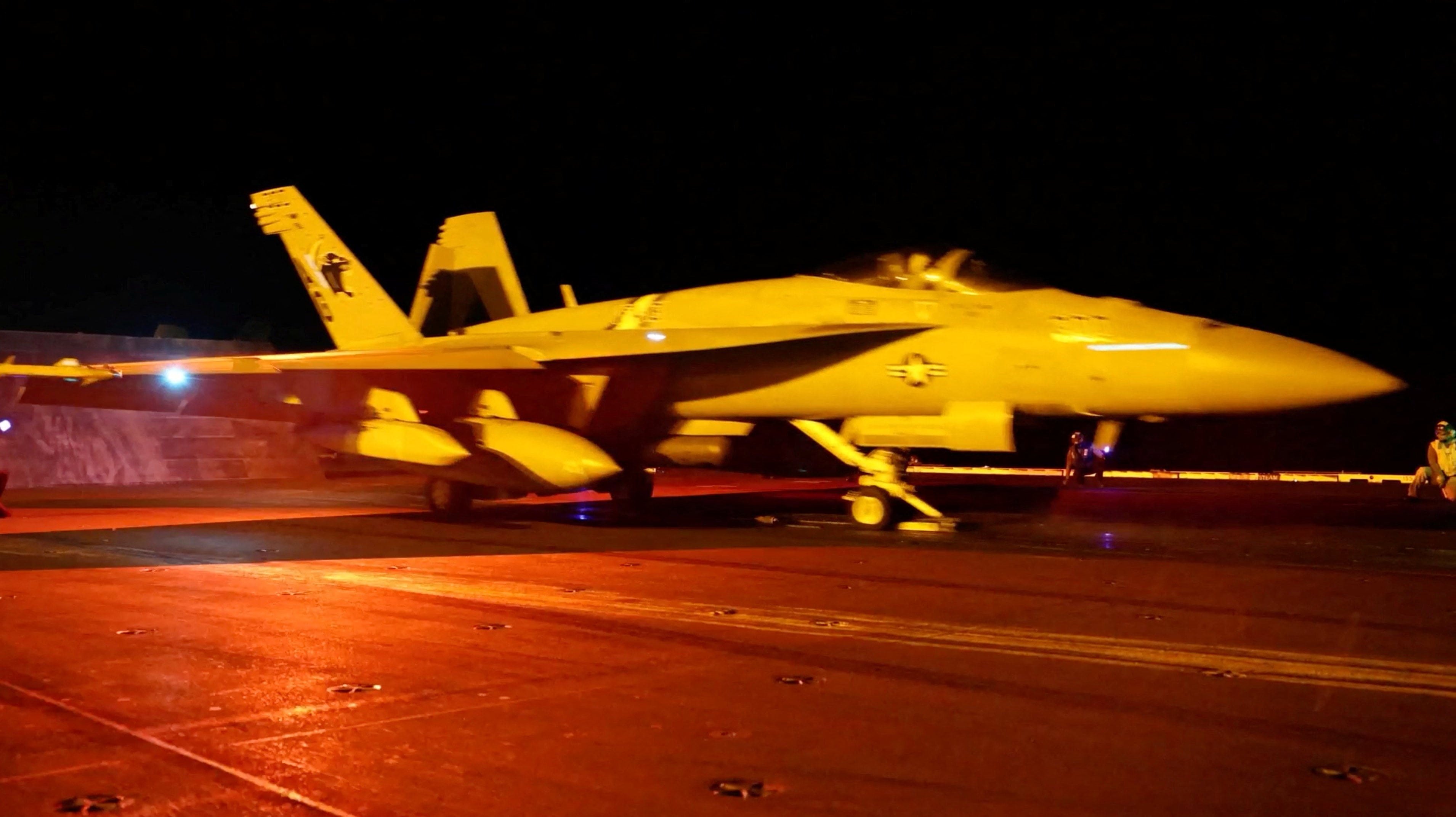 A warplane prepares for flight operations aboard a US aircraft carrier on the day US Central Command carried out air strikes against Iranian military targets. Photo: CENTCOM via Reuters
