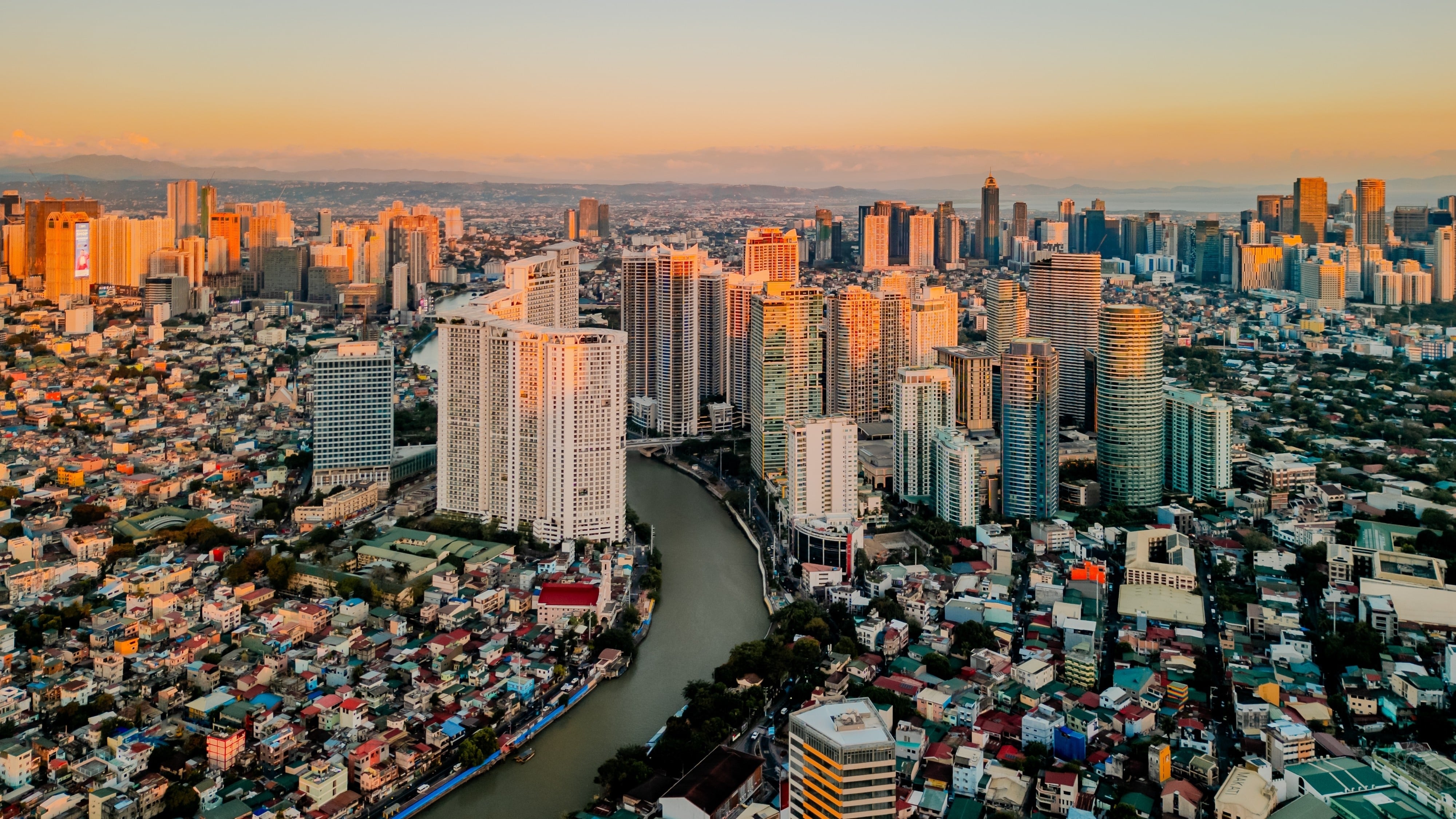 Makati City’s skyline. Some young professionals are using labels like “overworked Filipino worker” to document their hectic lifestyle in the financial district. Photo: Shutterstock