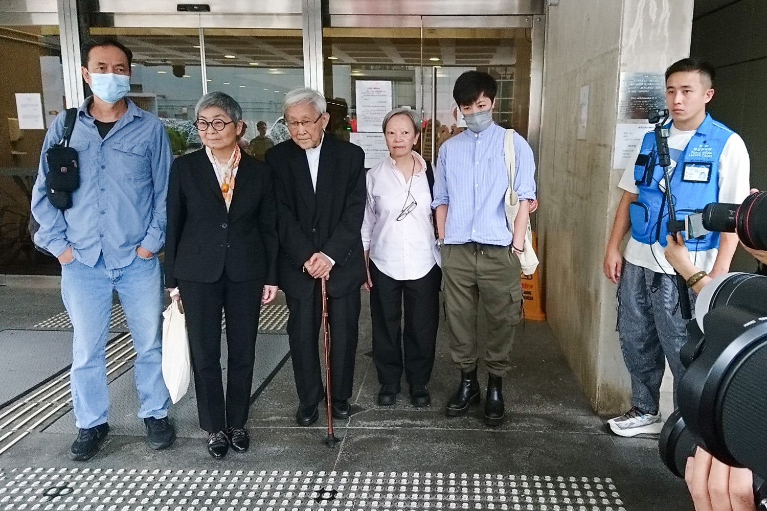 (From left) Defendants Hui Po-keung, Margaret Ng, Joseph Zen, Cyd Ho and Denise Ho outside the High Court on Thursday. Photo: Brian Wong