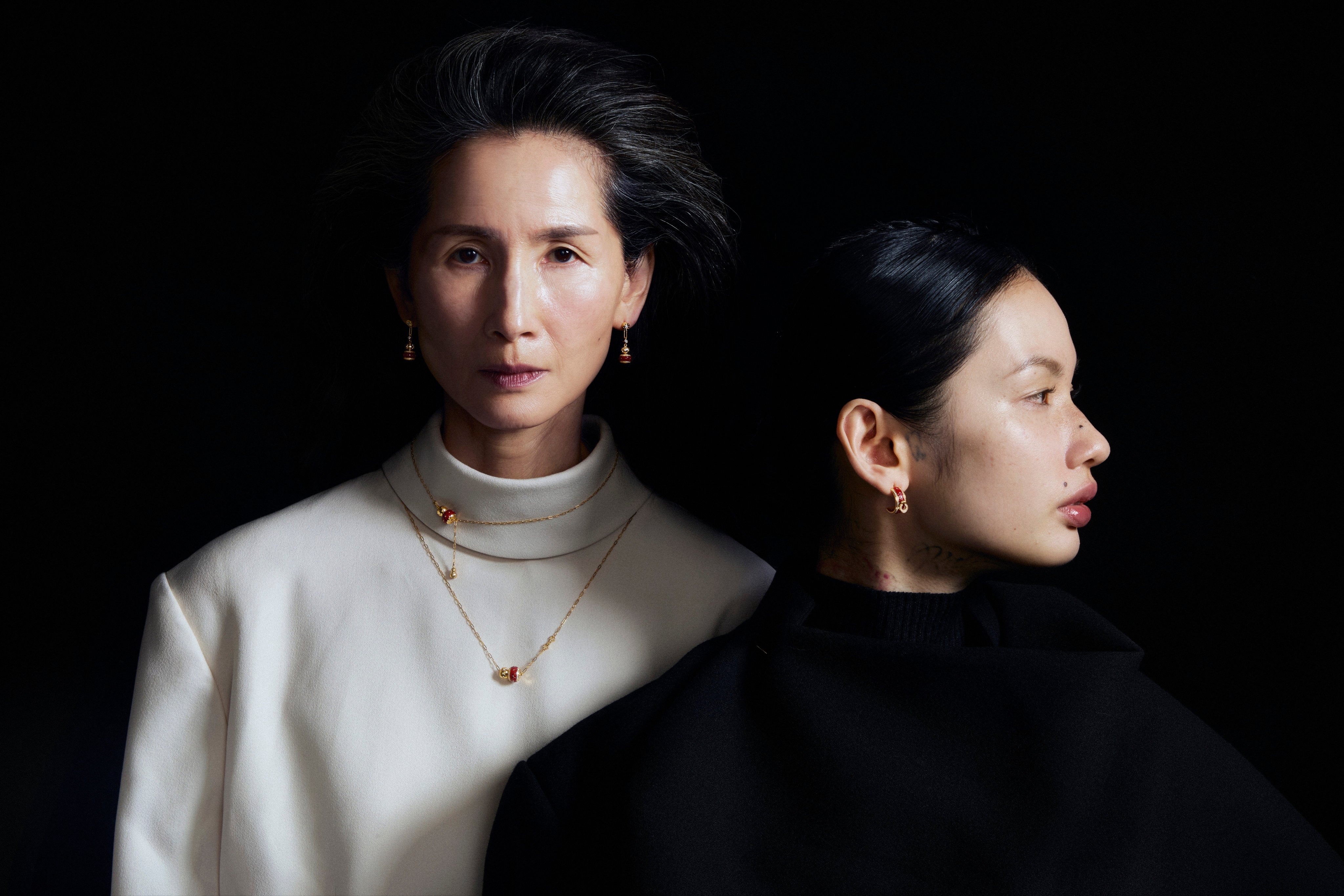 On Christina: earrings, necklaces Chow Tai Fook; top Issey Miyake. On Shiro: earring Chow Tai Fook; top Issey Miyake. Photography: Olivia Tsang