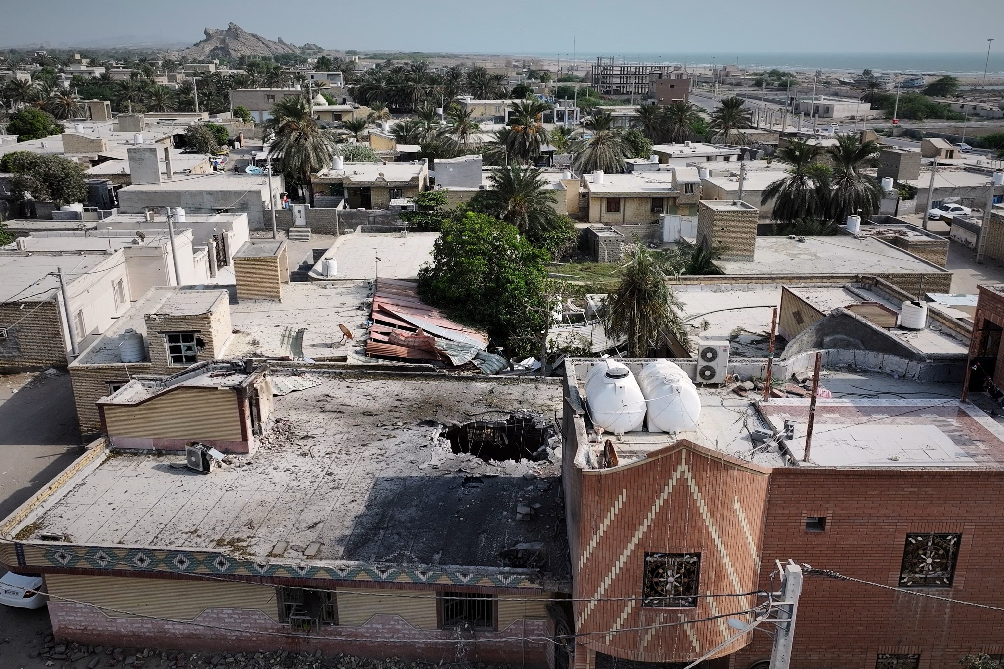 The impacted building and surrounding area. Photo: Tasnim News Agency via AP