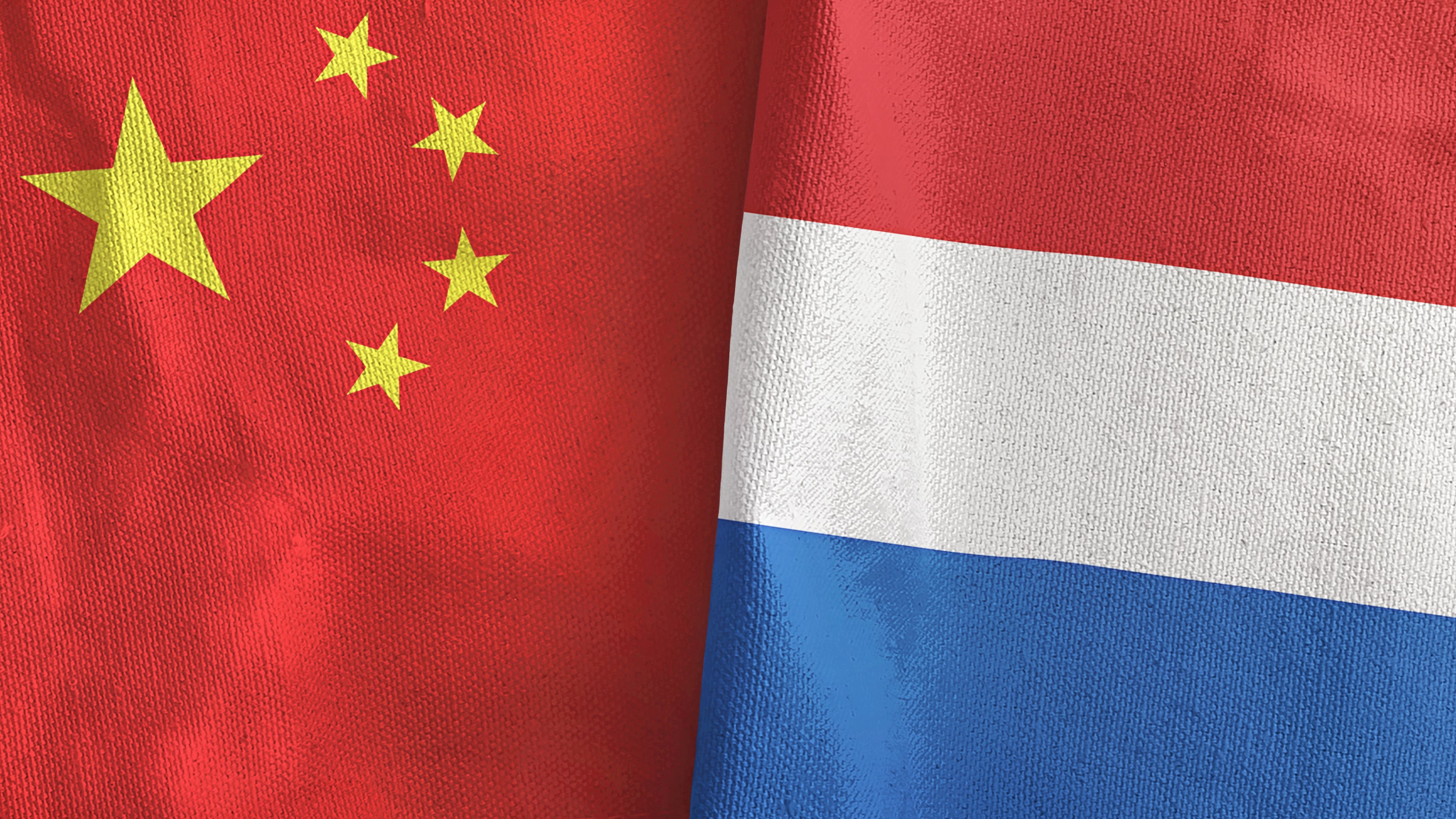 Flags of China and the Netherlands appear next to each other. Photo: Shutterstock