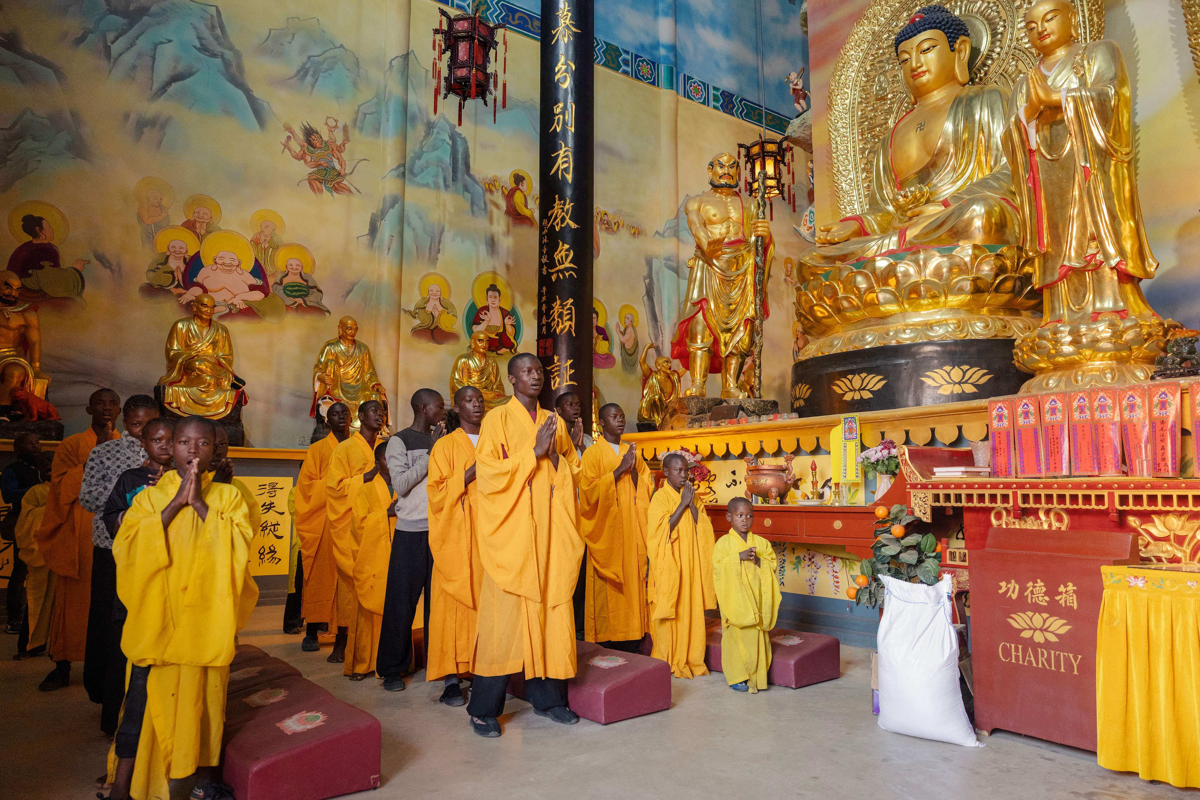 Students and monks pray at the Shaolin Temple outside Lusaka, on August 8, 2026. Photo: AFP